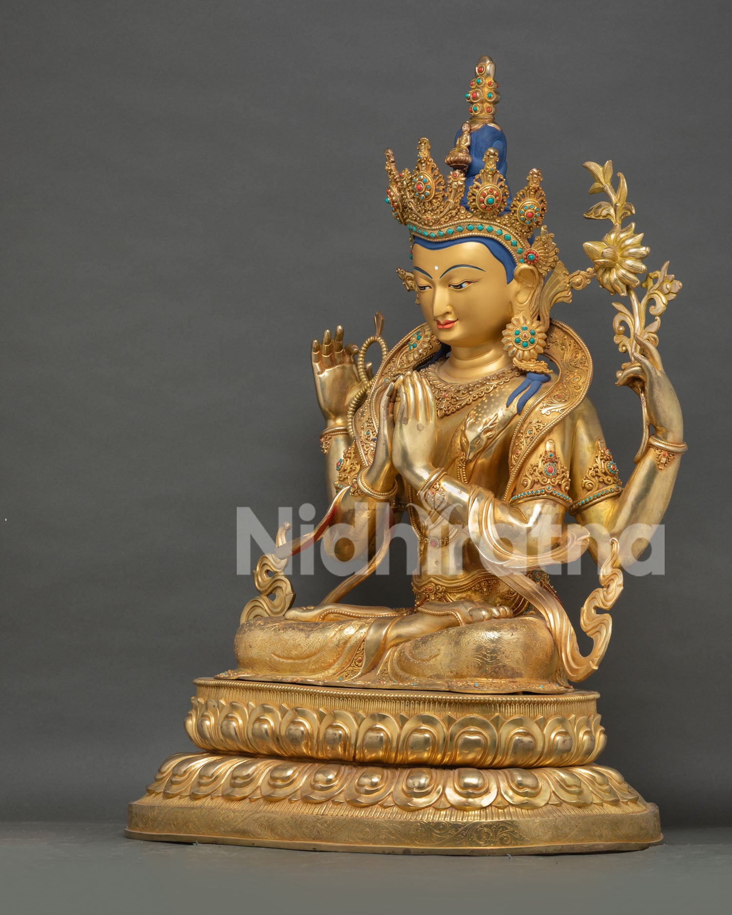 left side view chenrezig statue avalokiteshvara four armed bodhisattva fine metal craftsmanship