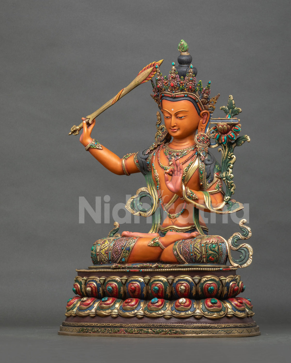 Left side view of handmade copper Manjushri Buddha Statue from Nepal