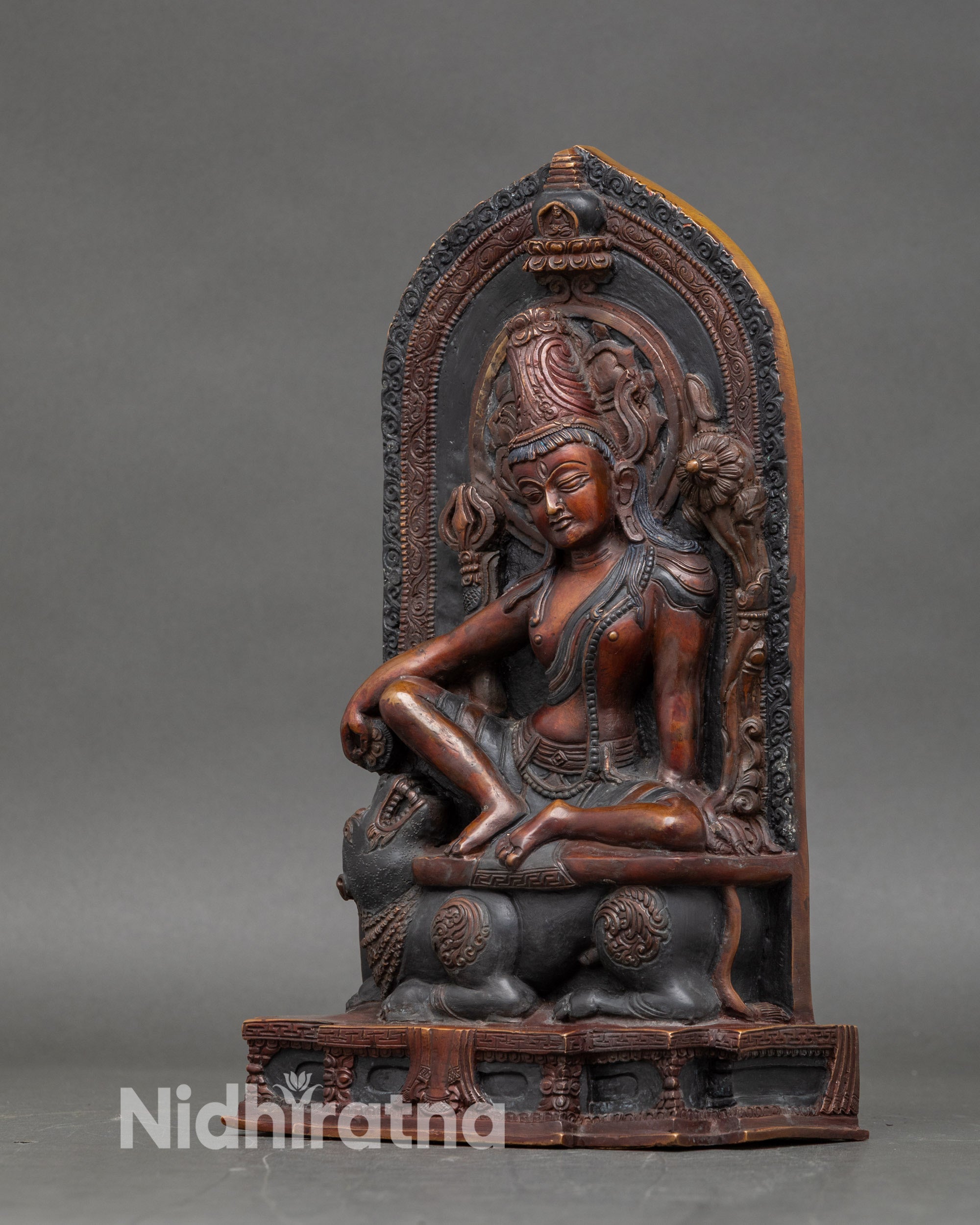 Left side view of Lokeshwor statue with intricate jewelry and ornamental crown