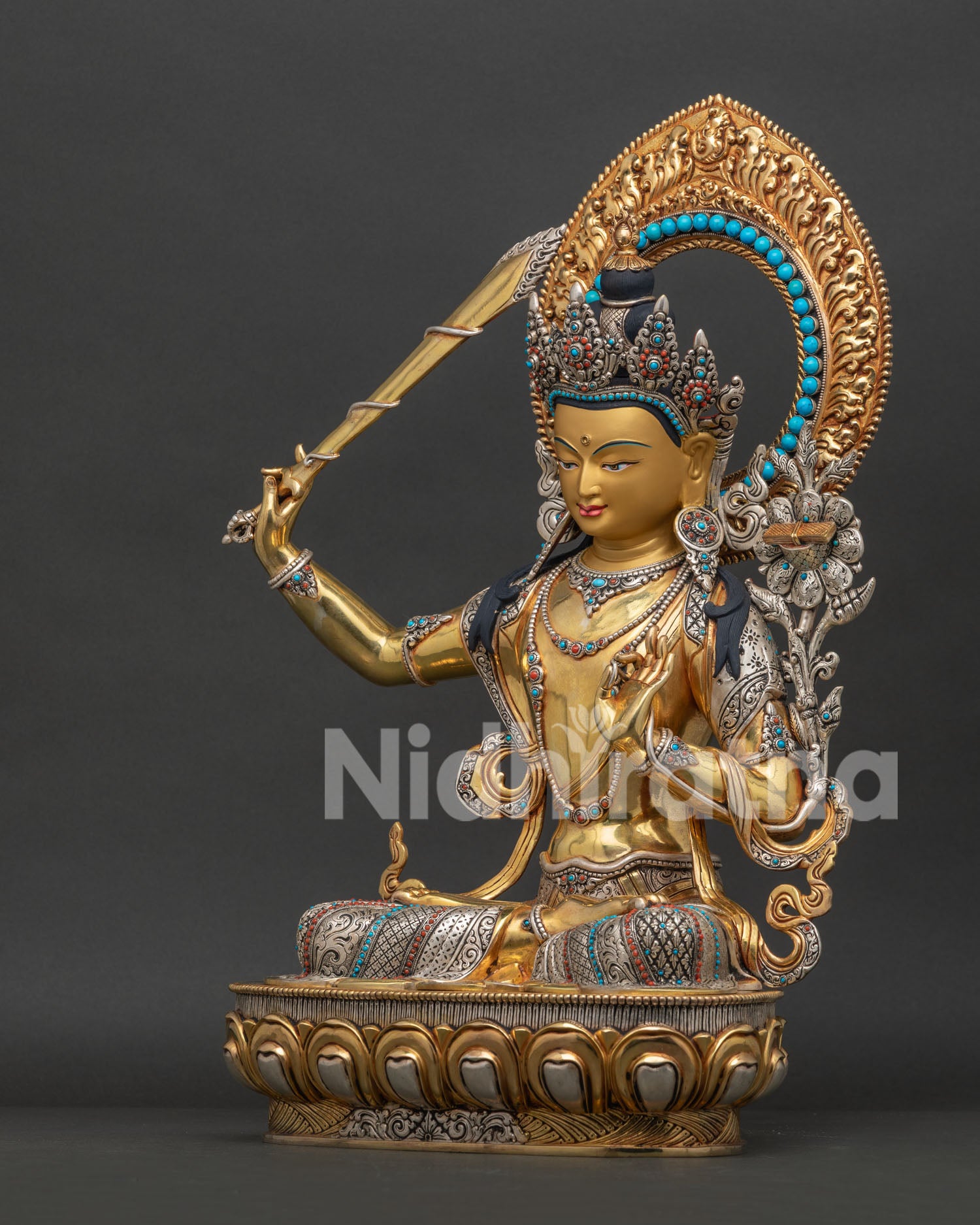 Left side view of Manjushri Statue with Prajnaparamita lotus and silver plated details