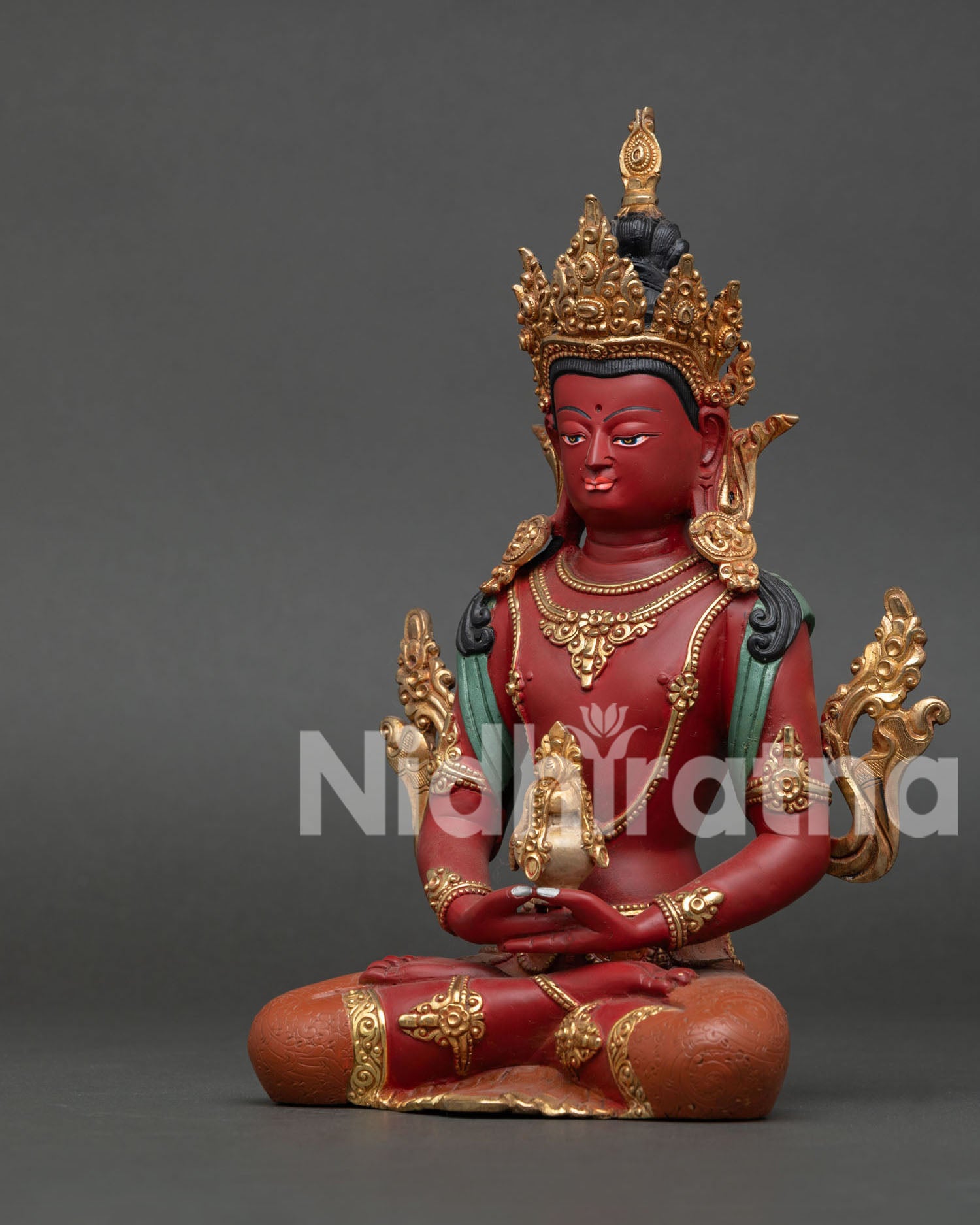 Left side view of Amitayus Statue, flowing robes and gold ornamentation