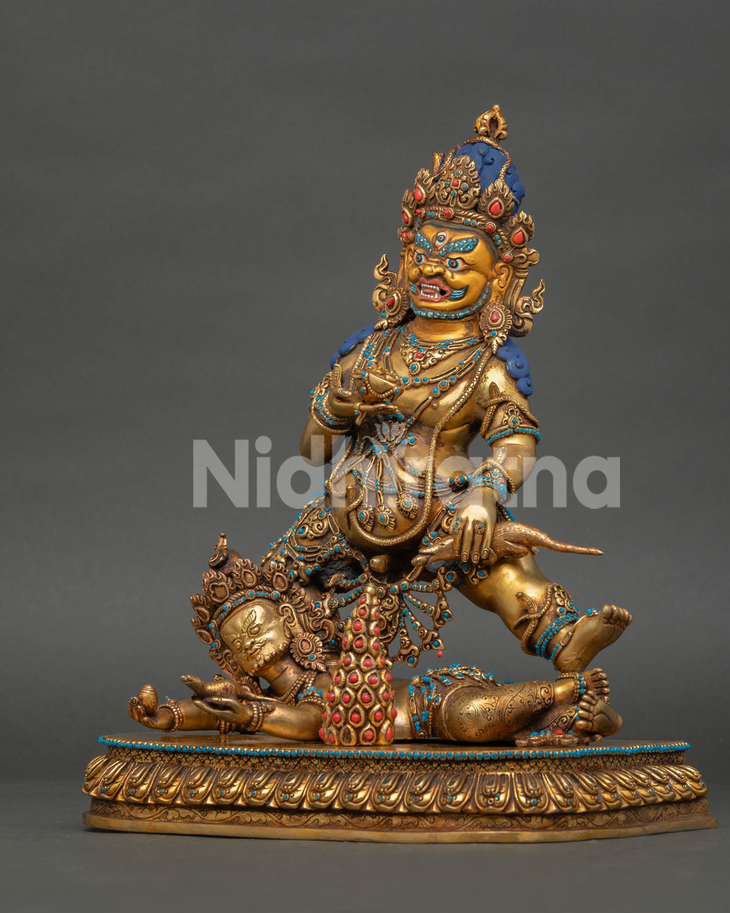 Left side view of Black Dzambhala Statue with copper body and handcrafted details