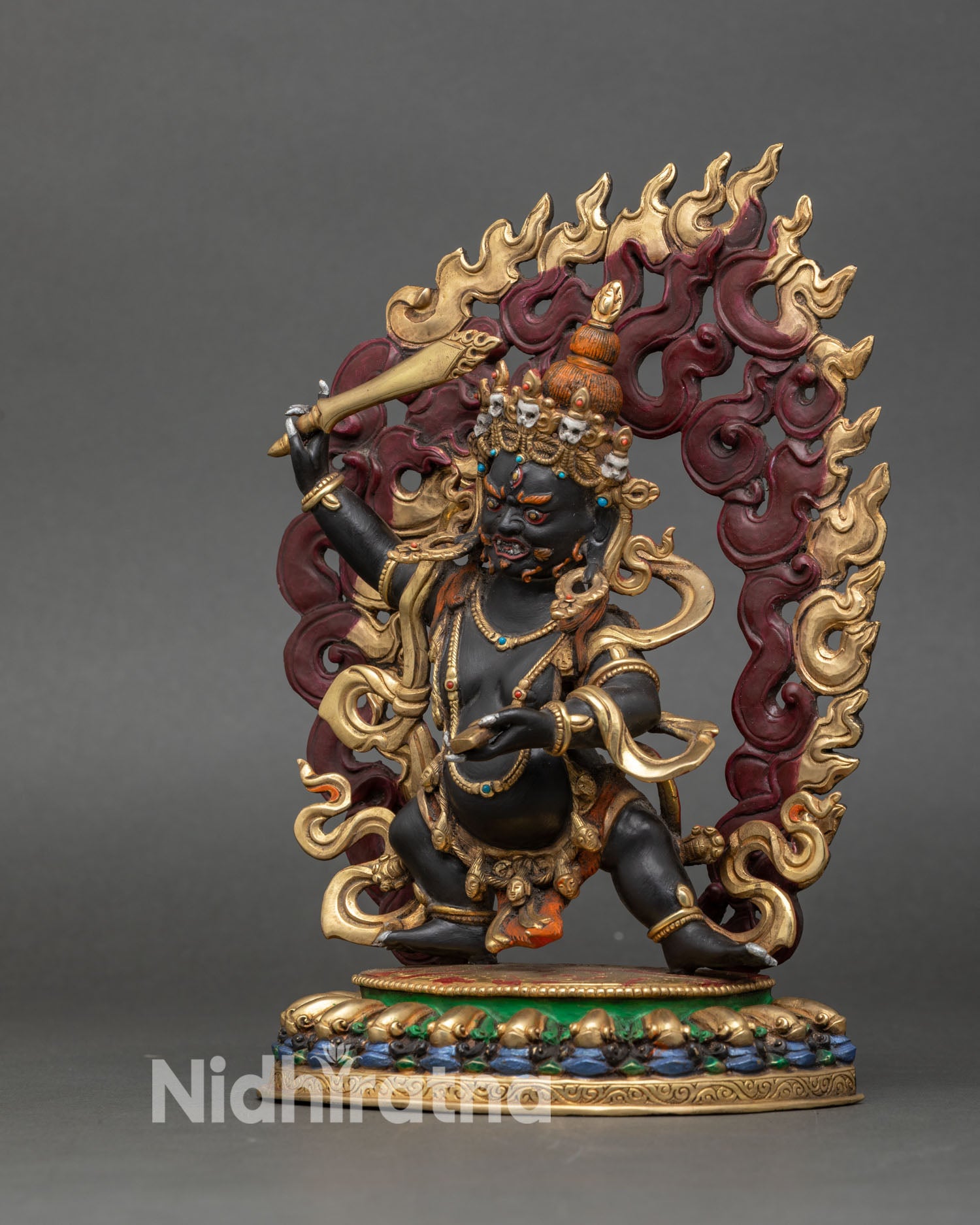Left side view of Black Manjushri Statue with detailed gold and acrylic finish