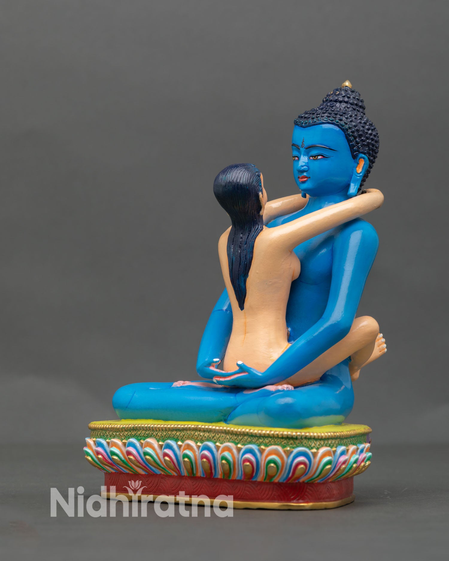 left side view of blue samantabhadra statue with consort on lotus throne