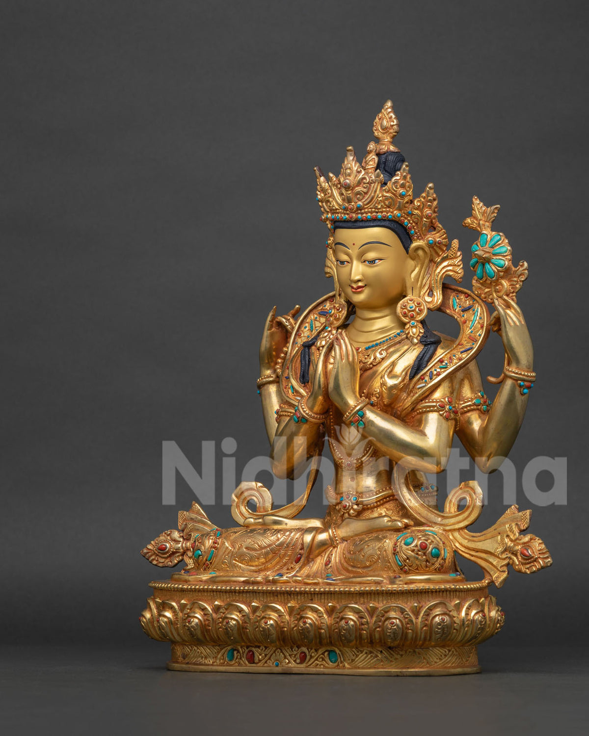 Left side view of Chenrezig statue on carved lotus pedestal, Nepal