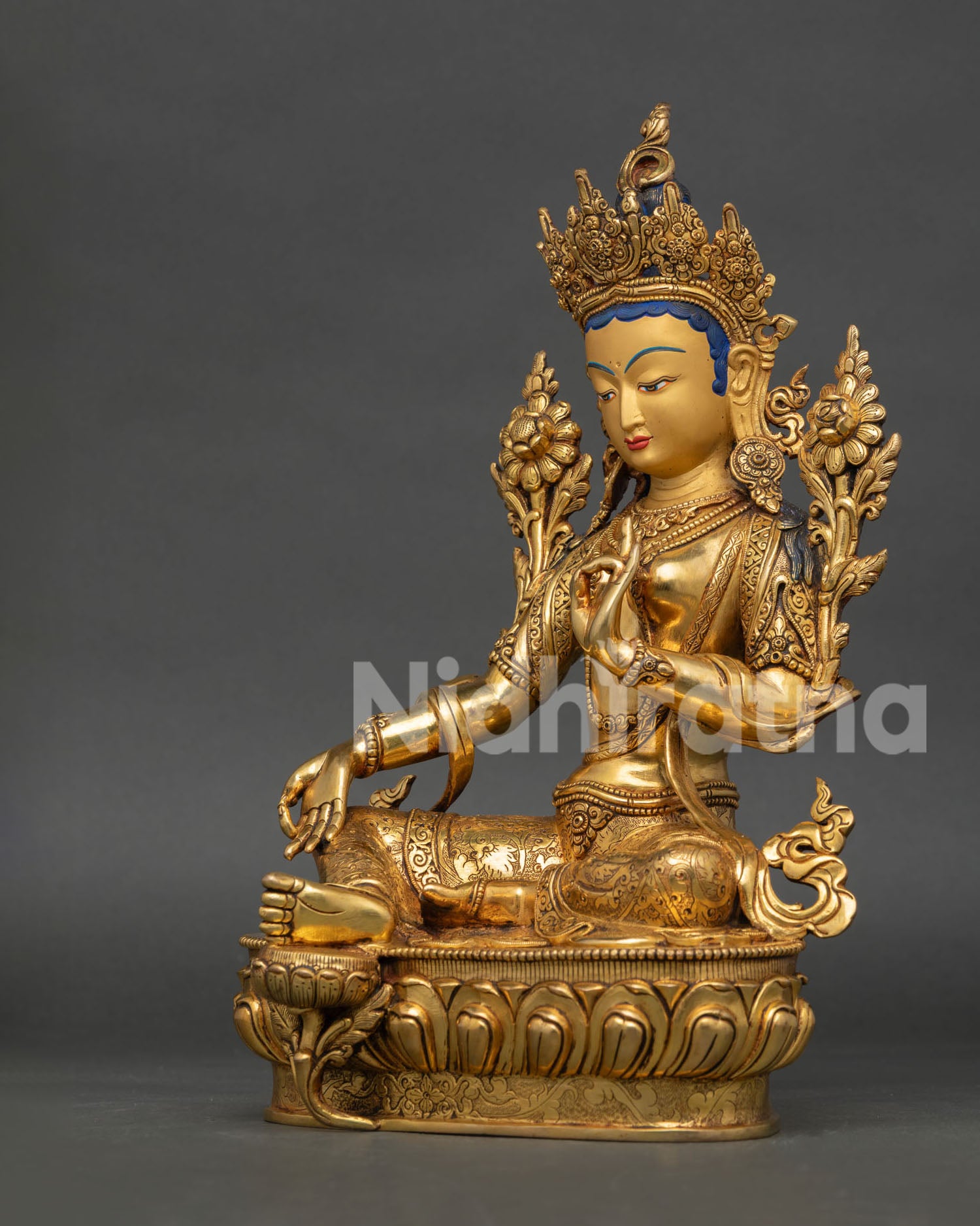 left side view of green tara drolma statue handcrafted by newari artisans