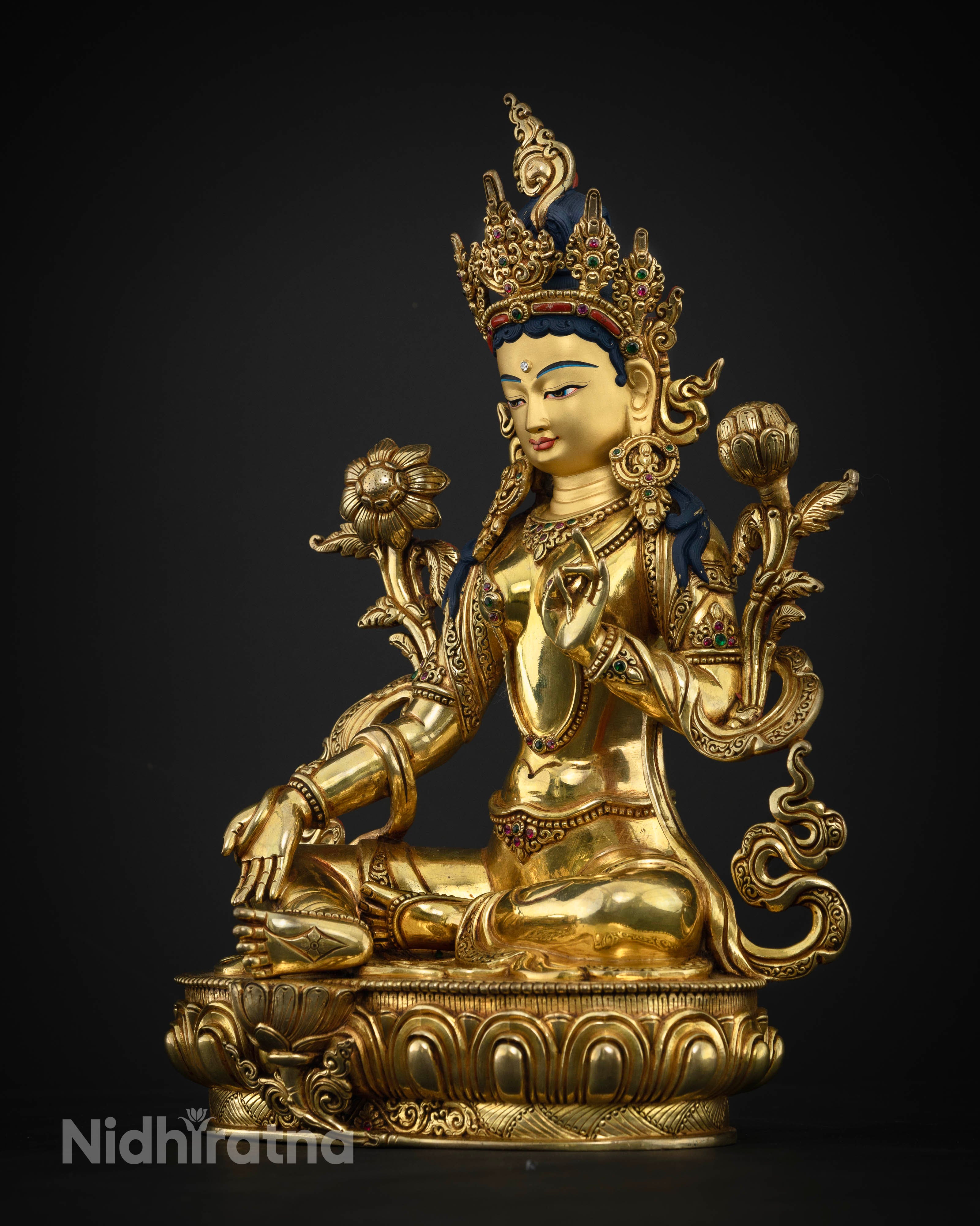 Left Side View of Green Tara statue with lotus pedestal and extended right leg