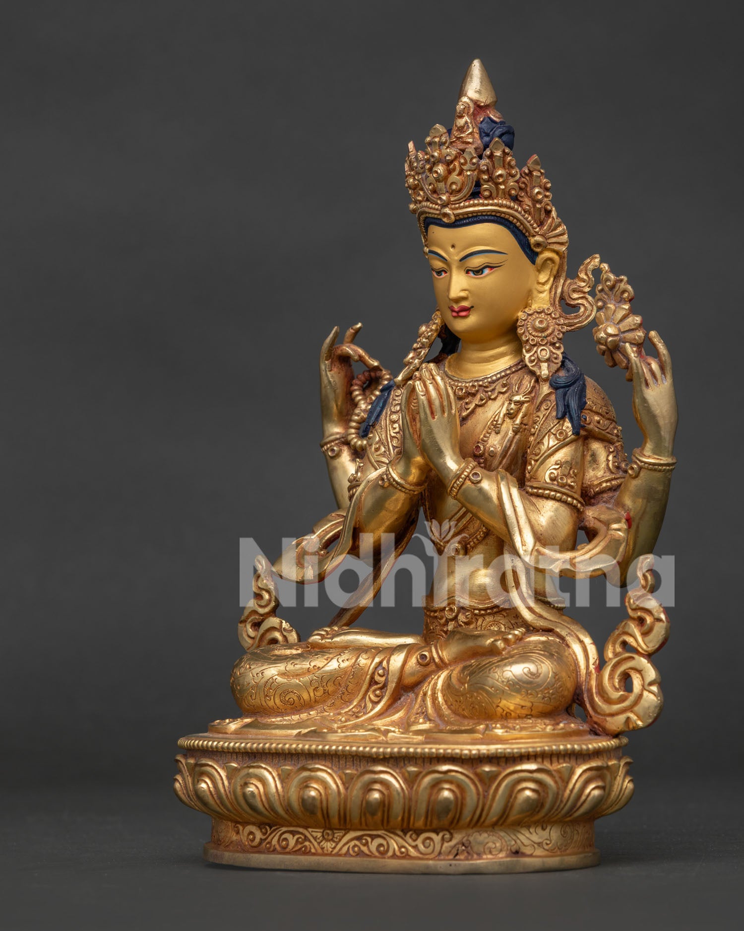 Left Side View of Handcrafted Chenrezig Statue Holding Sacred Lotus