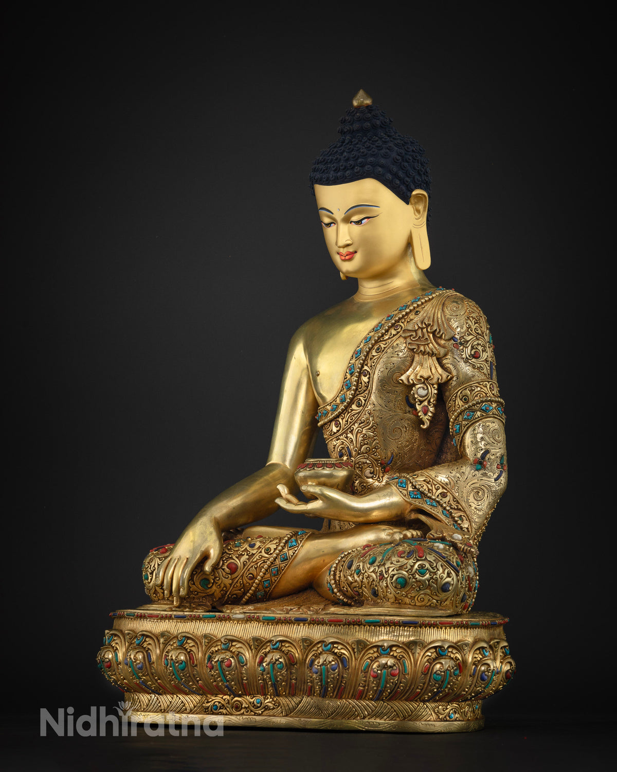 Left side view of handcrafted copper Shakyamuni Buddha statue with gold gilding