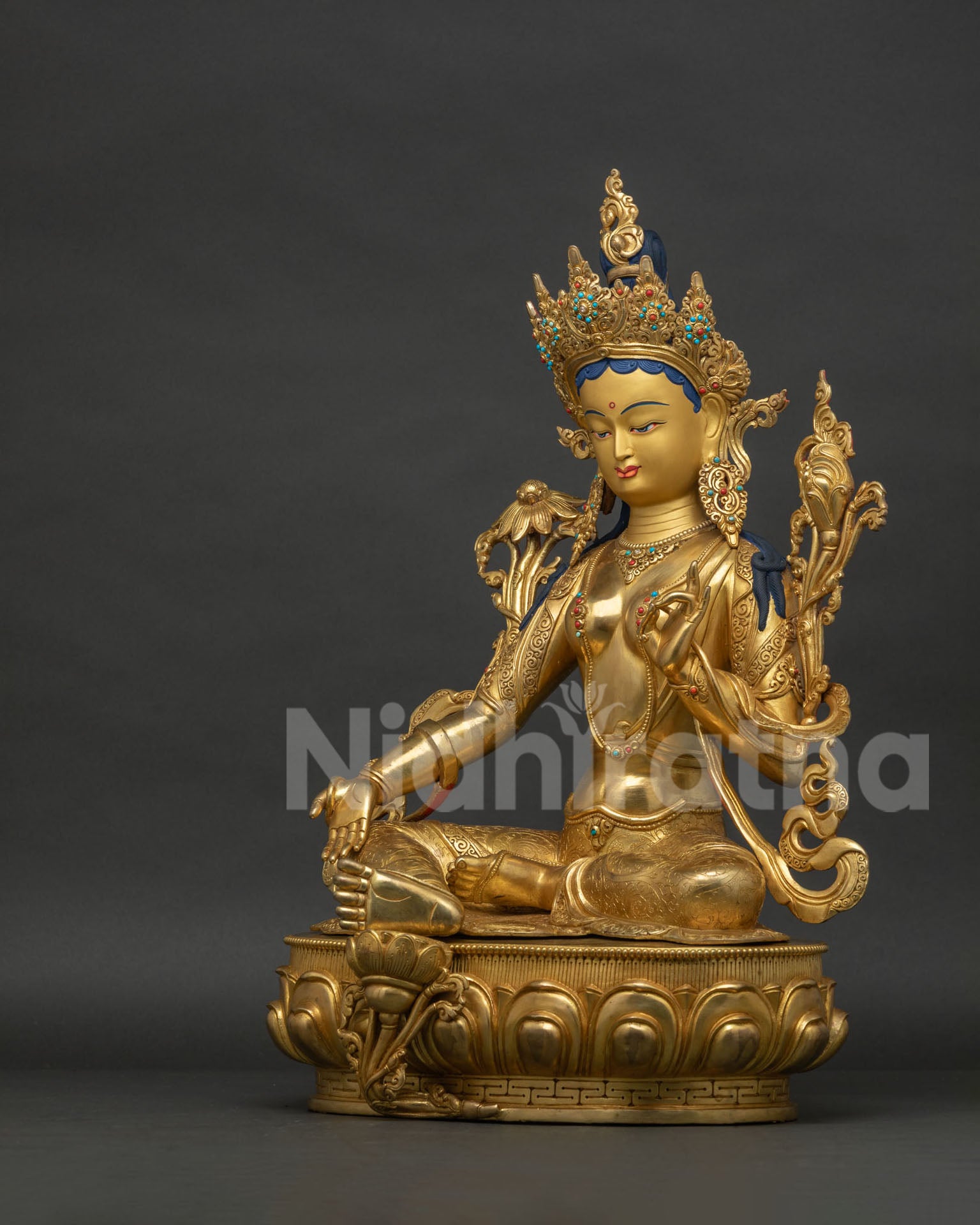 Left side view of handcrafted Green Tara Statue from Patan Nepal