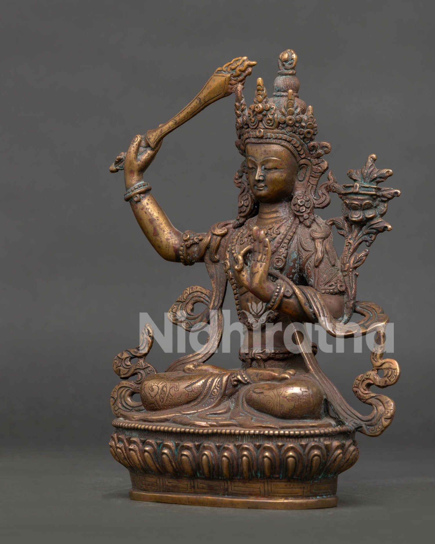 left side view of handmade manjushri bodhisattva statue from nepal