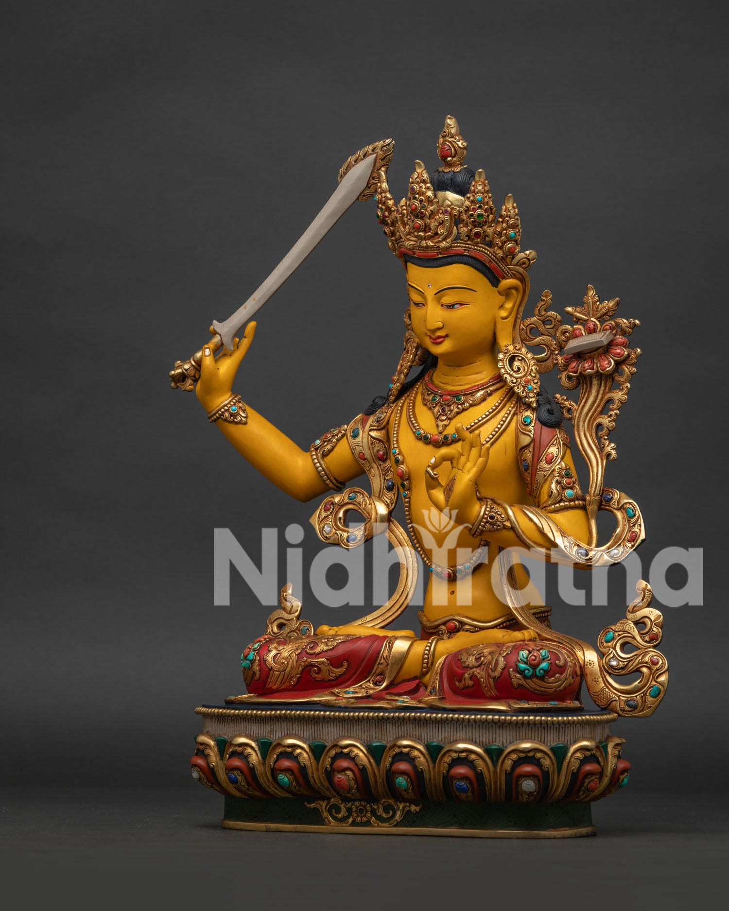 Left side view of Manjushri statue showing lotus-borne Prajnaparamita scripture