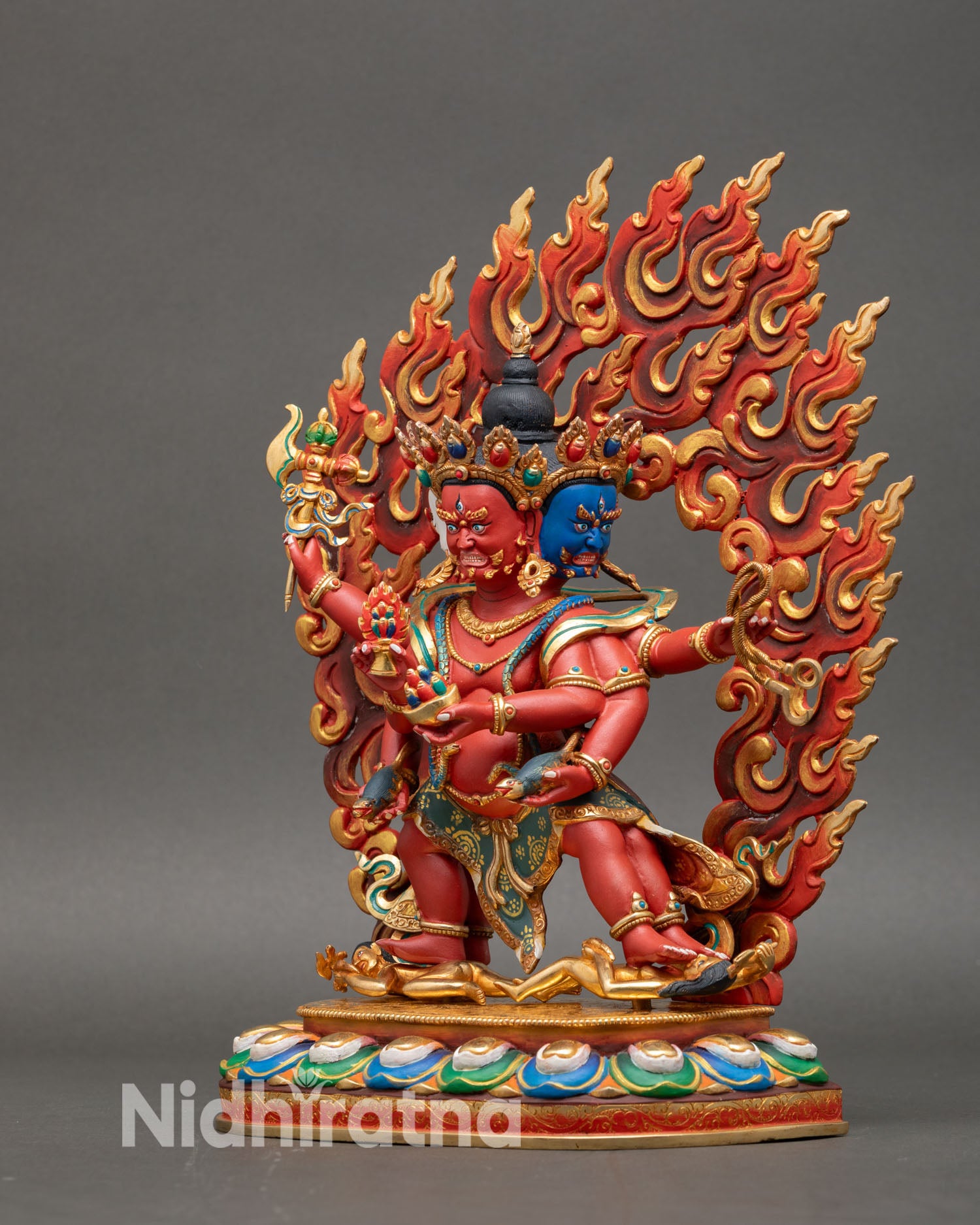 Left side view of Marpo Red Dzambhala statue six arms sacred attributes generosity spiritual energy