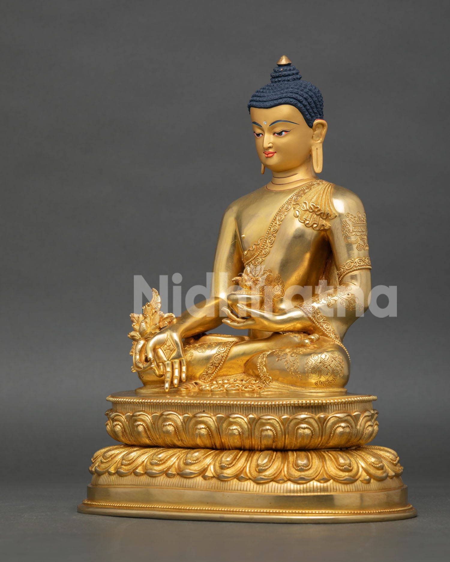 left side view of medicine buddha sculpture showcasing handcrafted buddhist art details