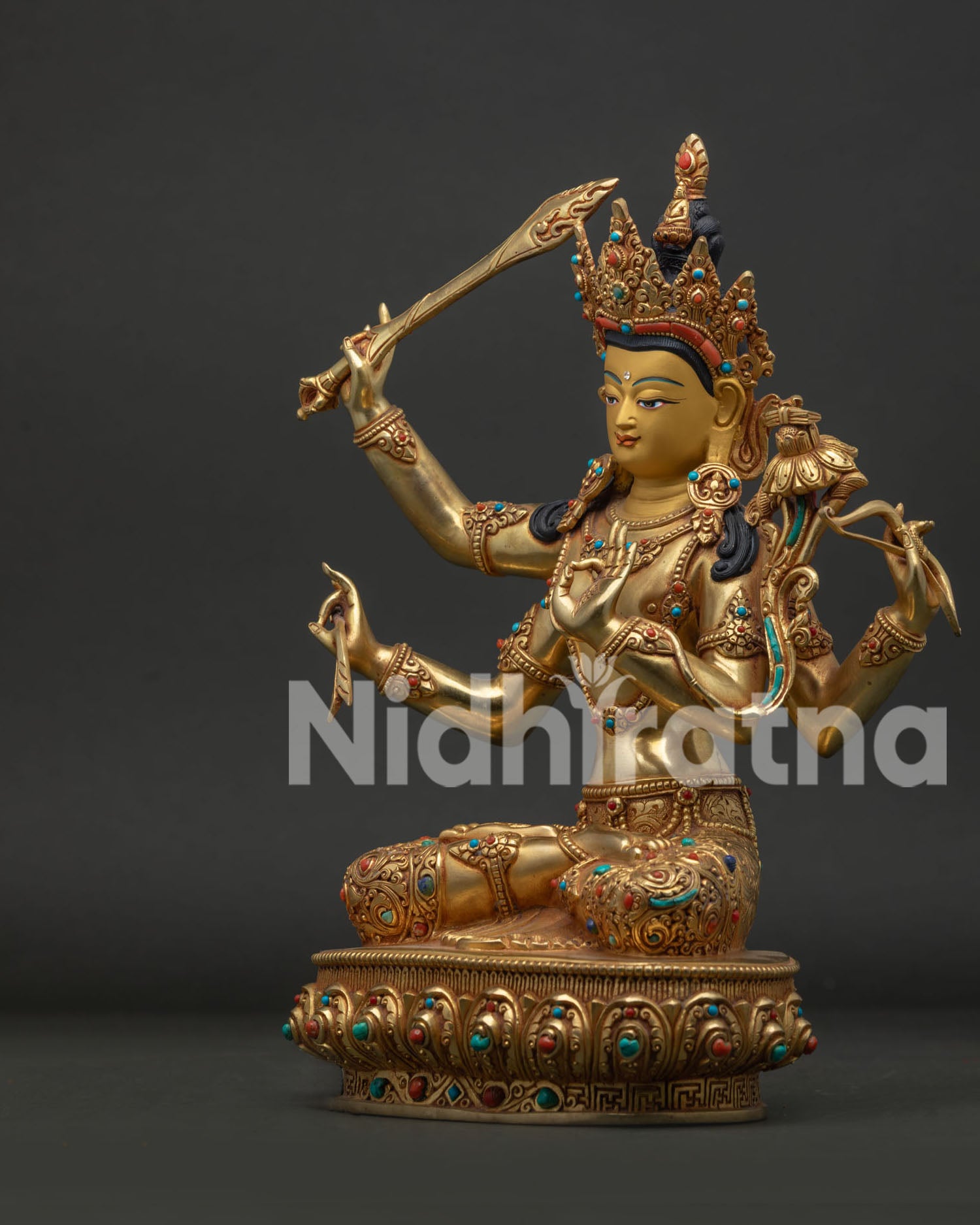 Left side view of Namasangiti Maha Manjushri Statue with sacred bow sword and sutra
