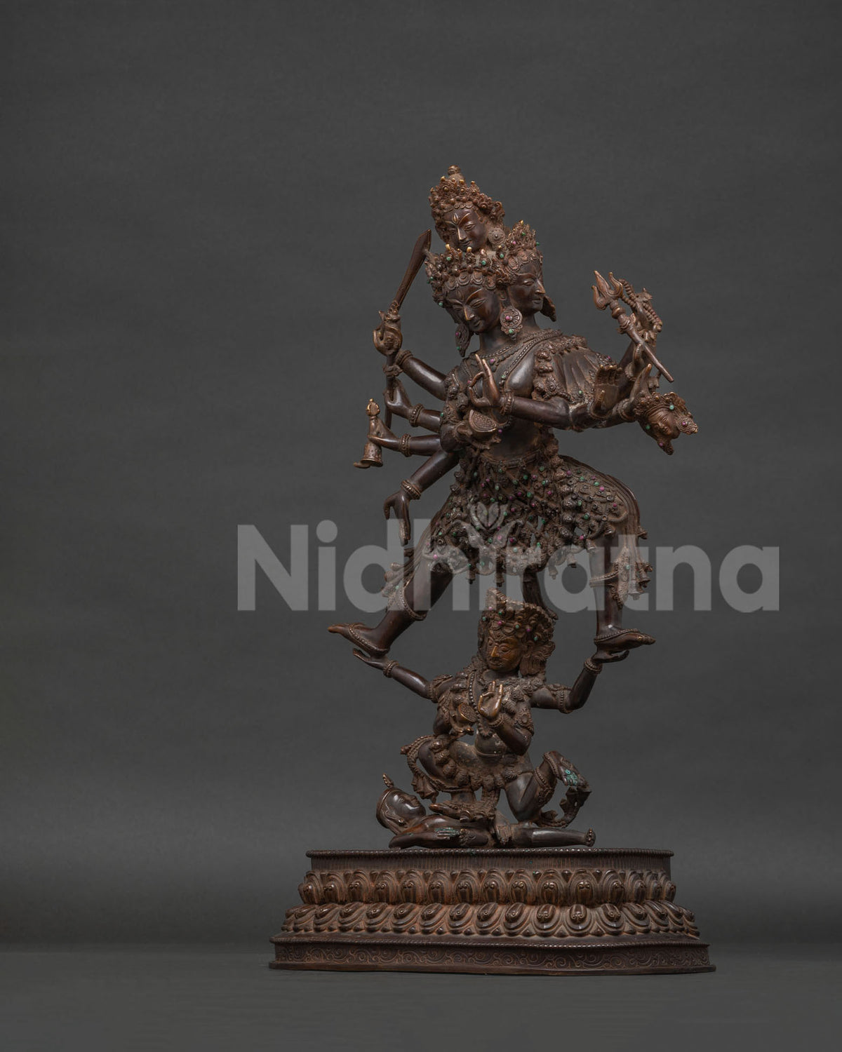 Left side view of oxidized copper Siddhi Lakshmi statue on lotus pedestal