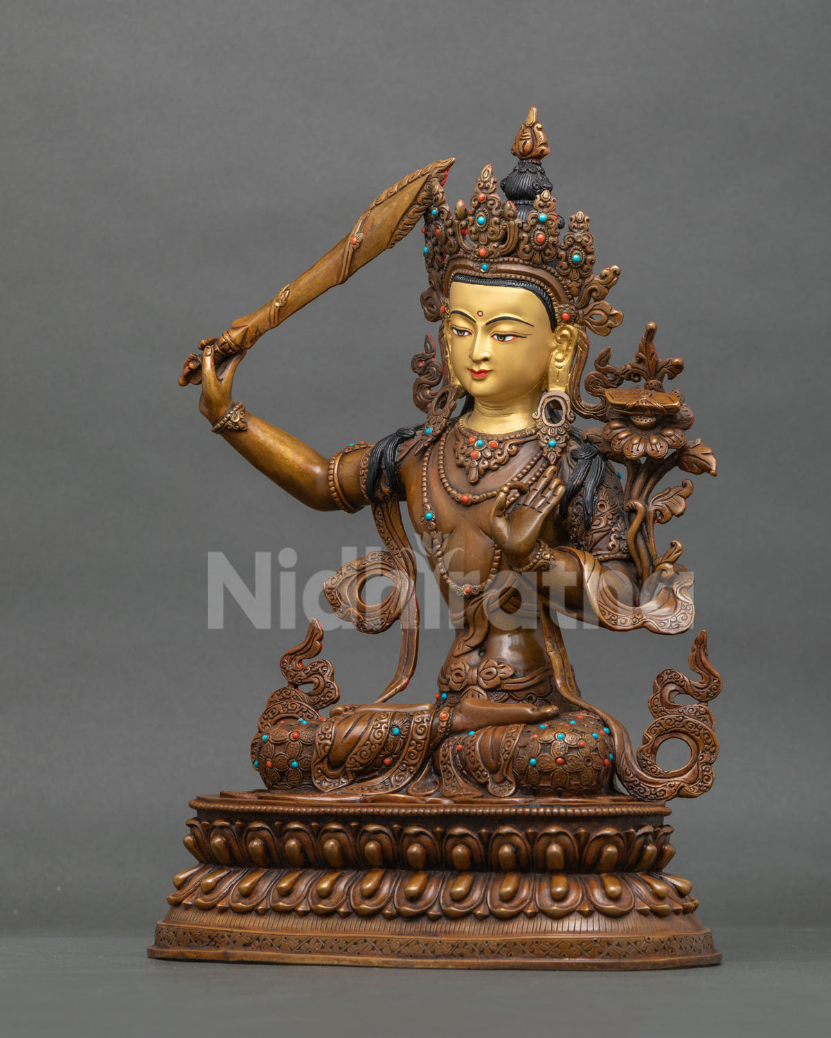 Left side view of oxidized Manjushri copper statue, Nepalese Buddhist wisdom deity figurine
