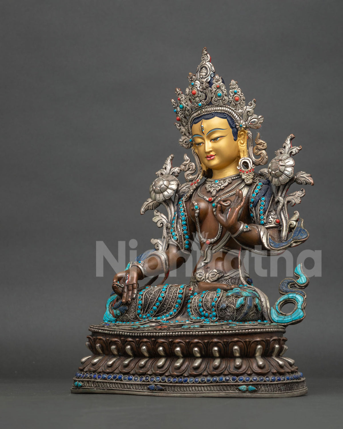 Left side view of Seven-Eyed White Tara statue, Nepalese copper sculpture with lapis lazuli accents