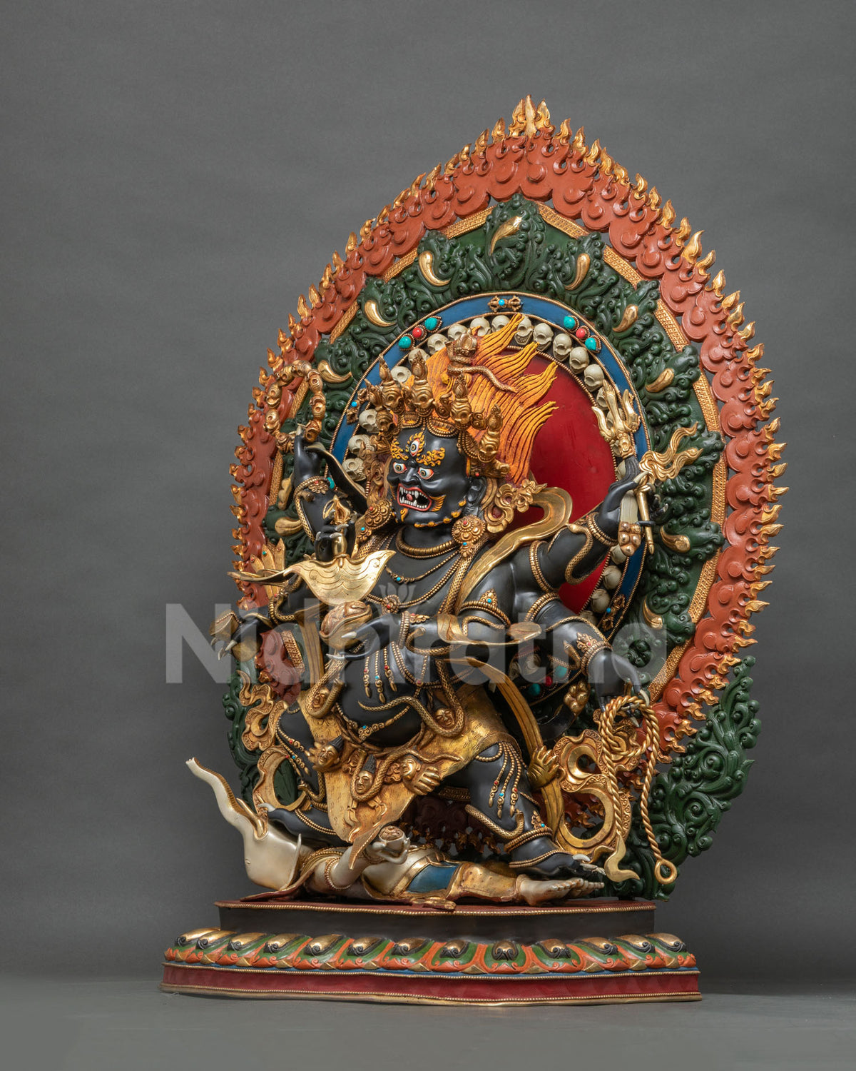 Left side view of Shadbhuja Mahakala sculpture holding Kartika knife and Kapala, Newari craftsmanship