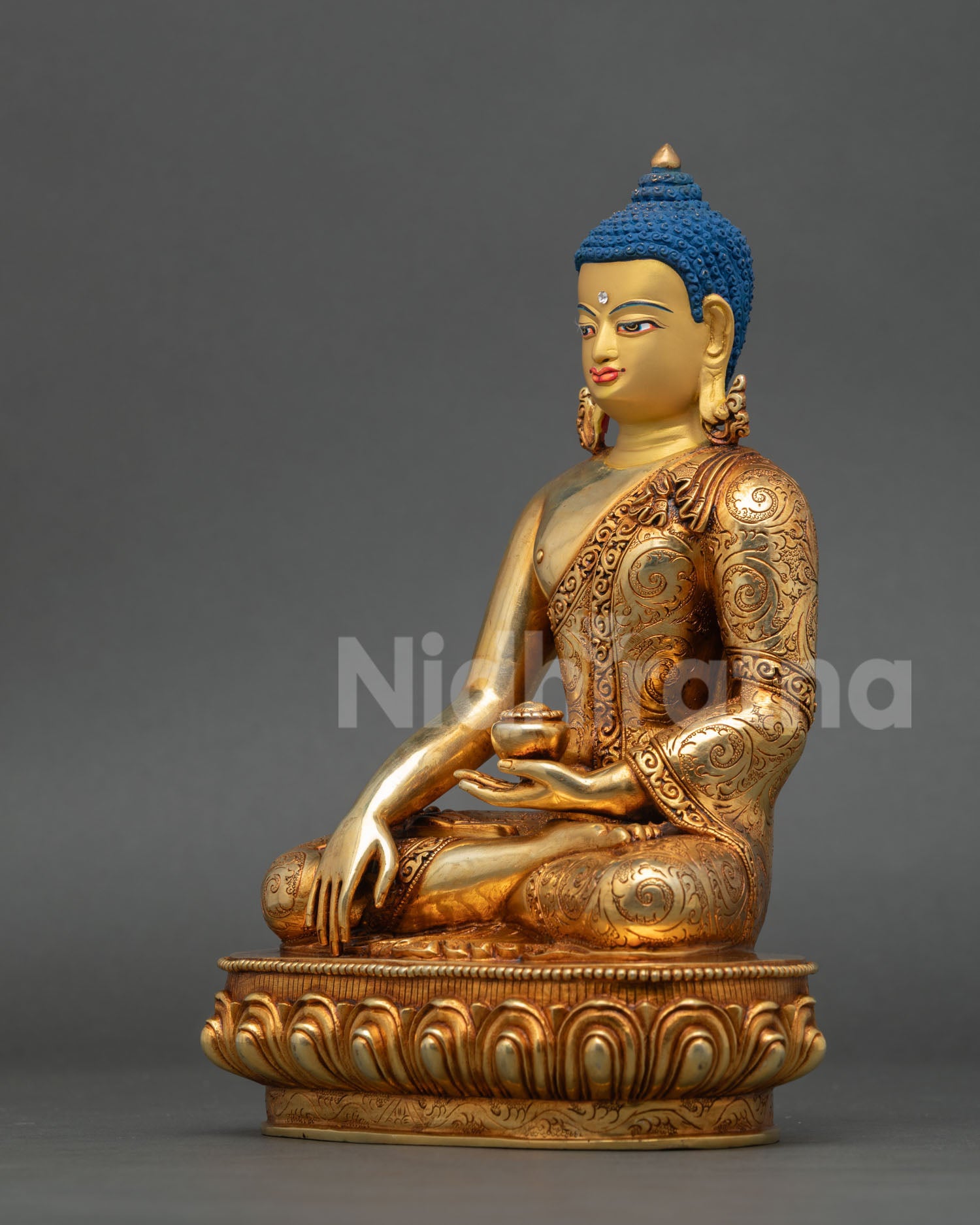left side view of shakyamuni buddha statue, holding begging bowl with earth-touching gesture