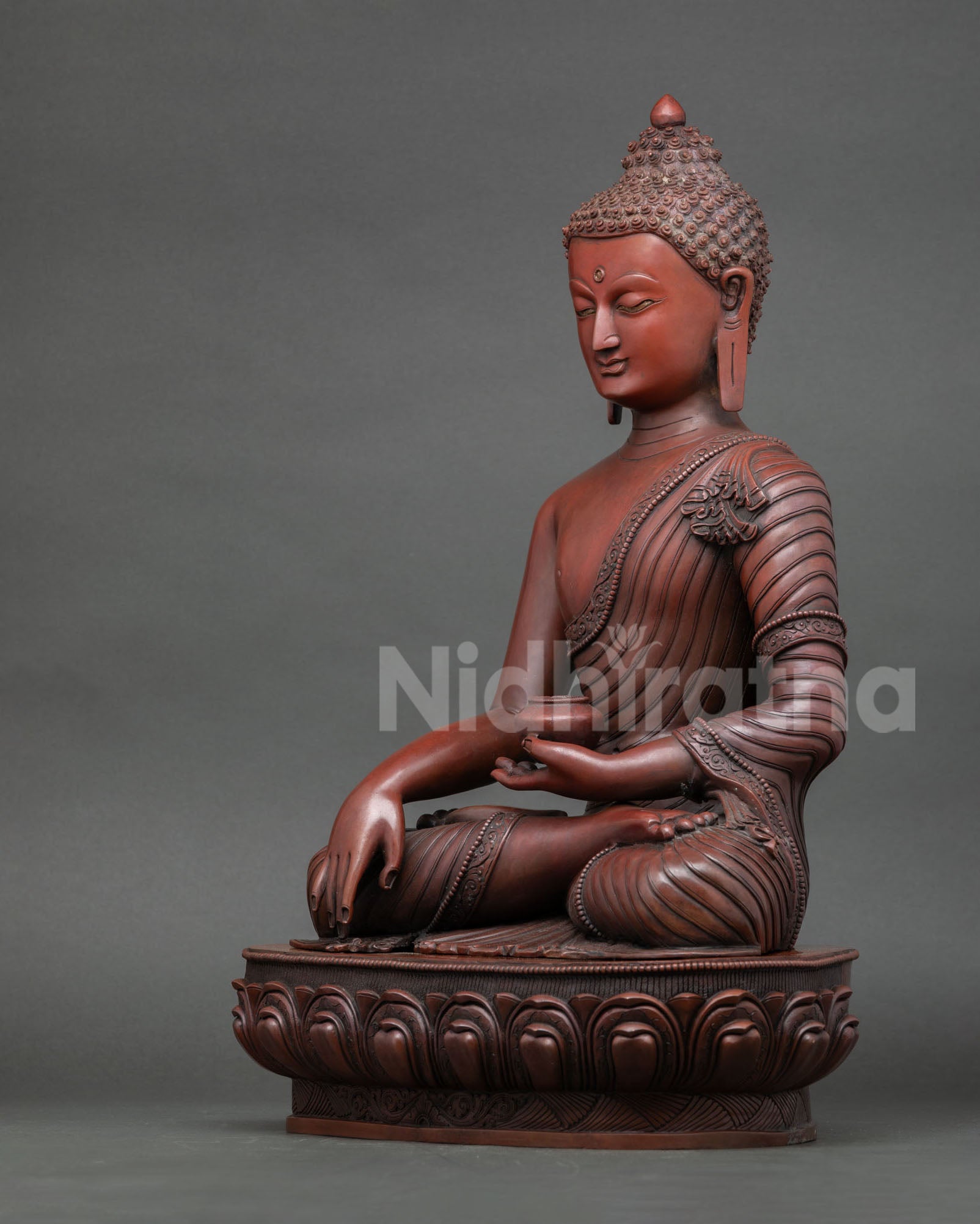 Left side view of Shakyamuni Buddha statue oxidized copper finish and robe carving