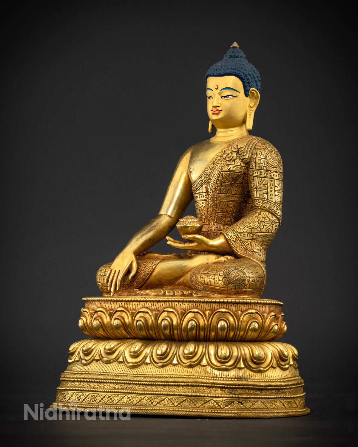 Left side view of Shakyamuni Buddha Statue seated on a double lotus throne