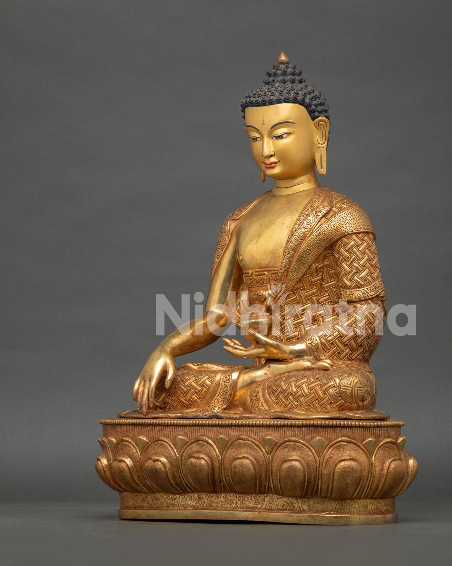 left side view of shakyamuni buddha statue showing copper craftsmanship