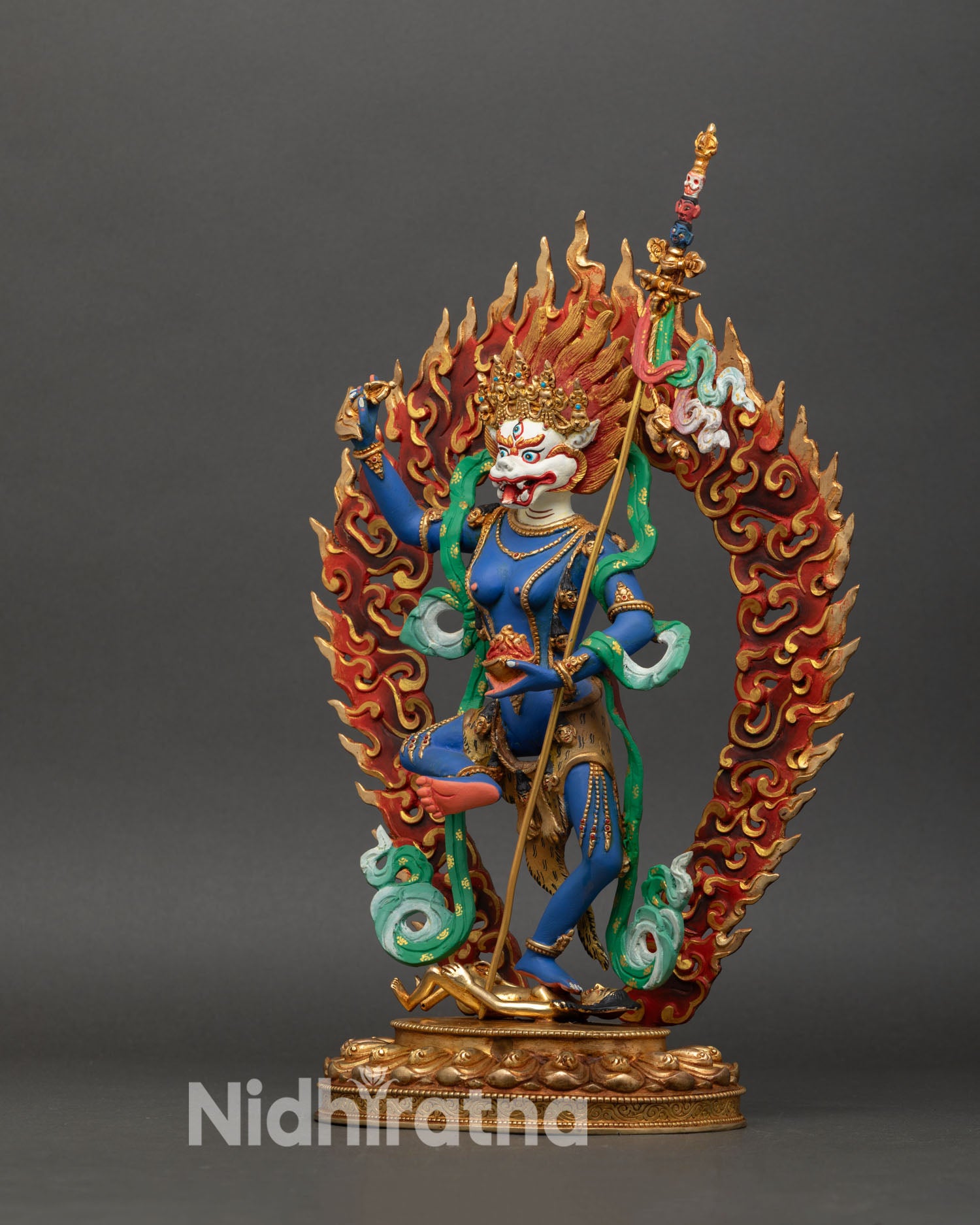 Left side view of Simhamukha Statue, copper and gold details, lotus seat and ritual implements