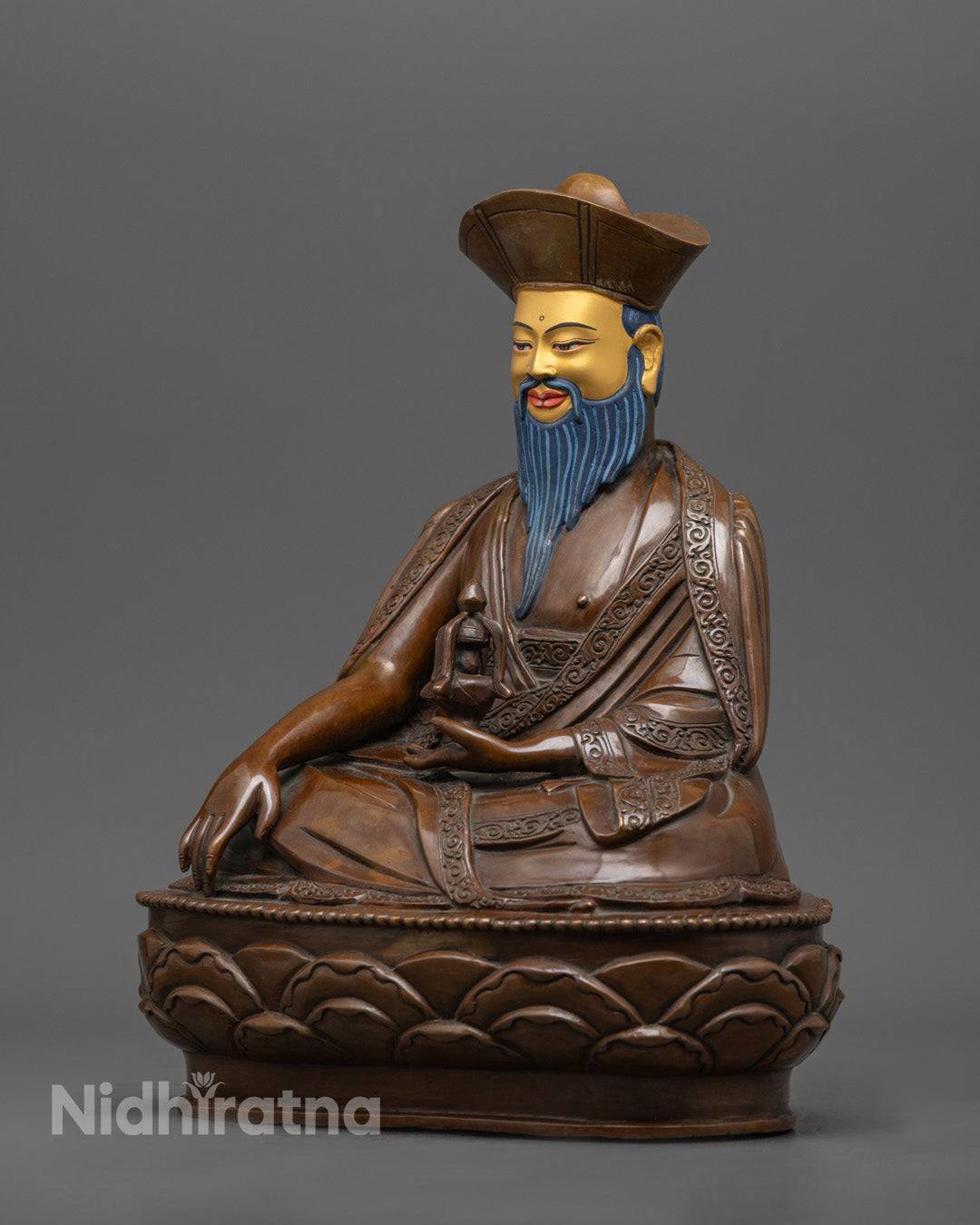left side view of zhabdrung rinpoche statue, handcrafted copper with acrylic painted details