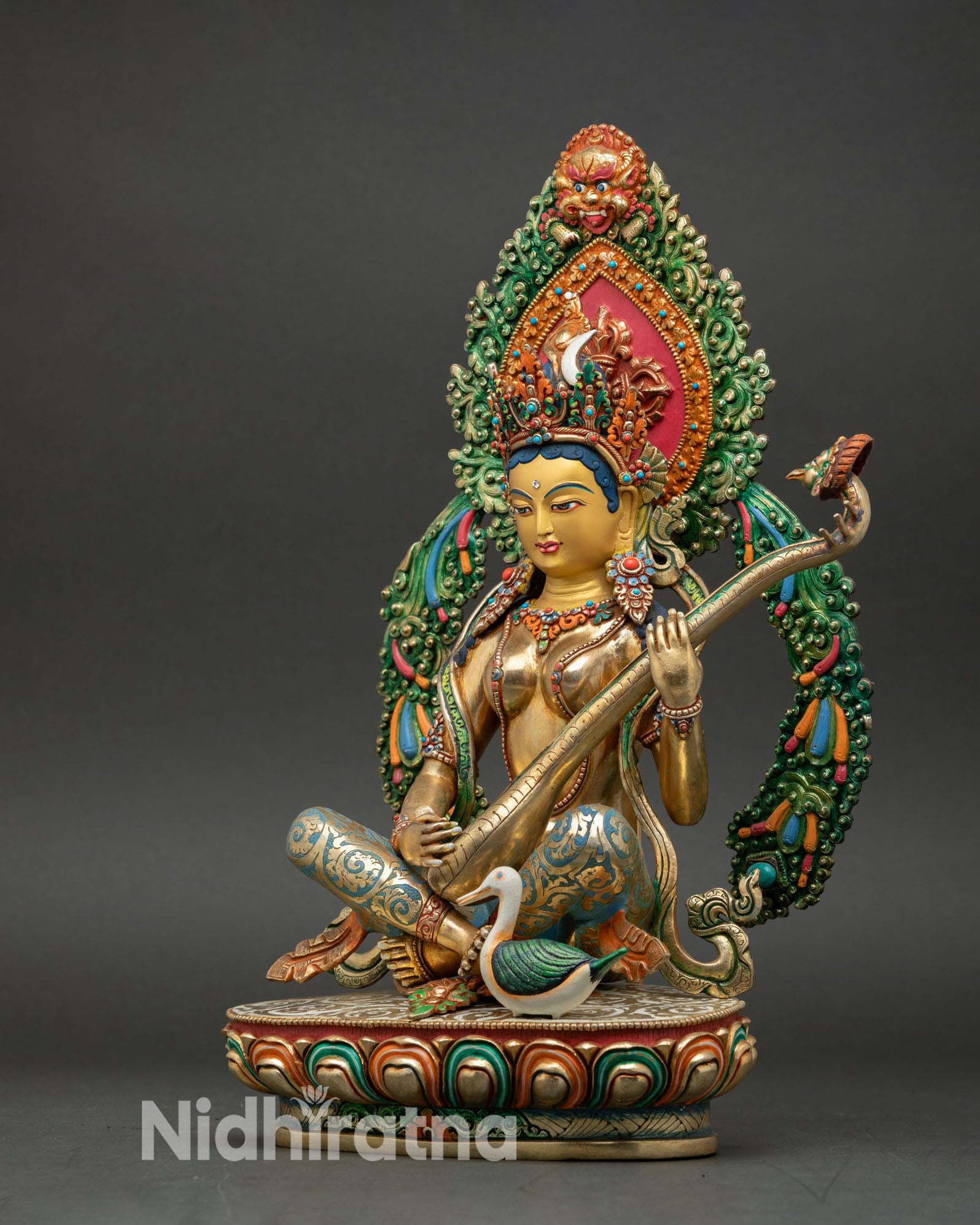 left side view saraswati statue, handcrafted nepalese goddess with lotus base