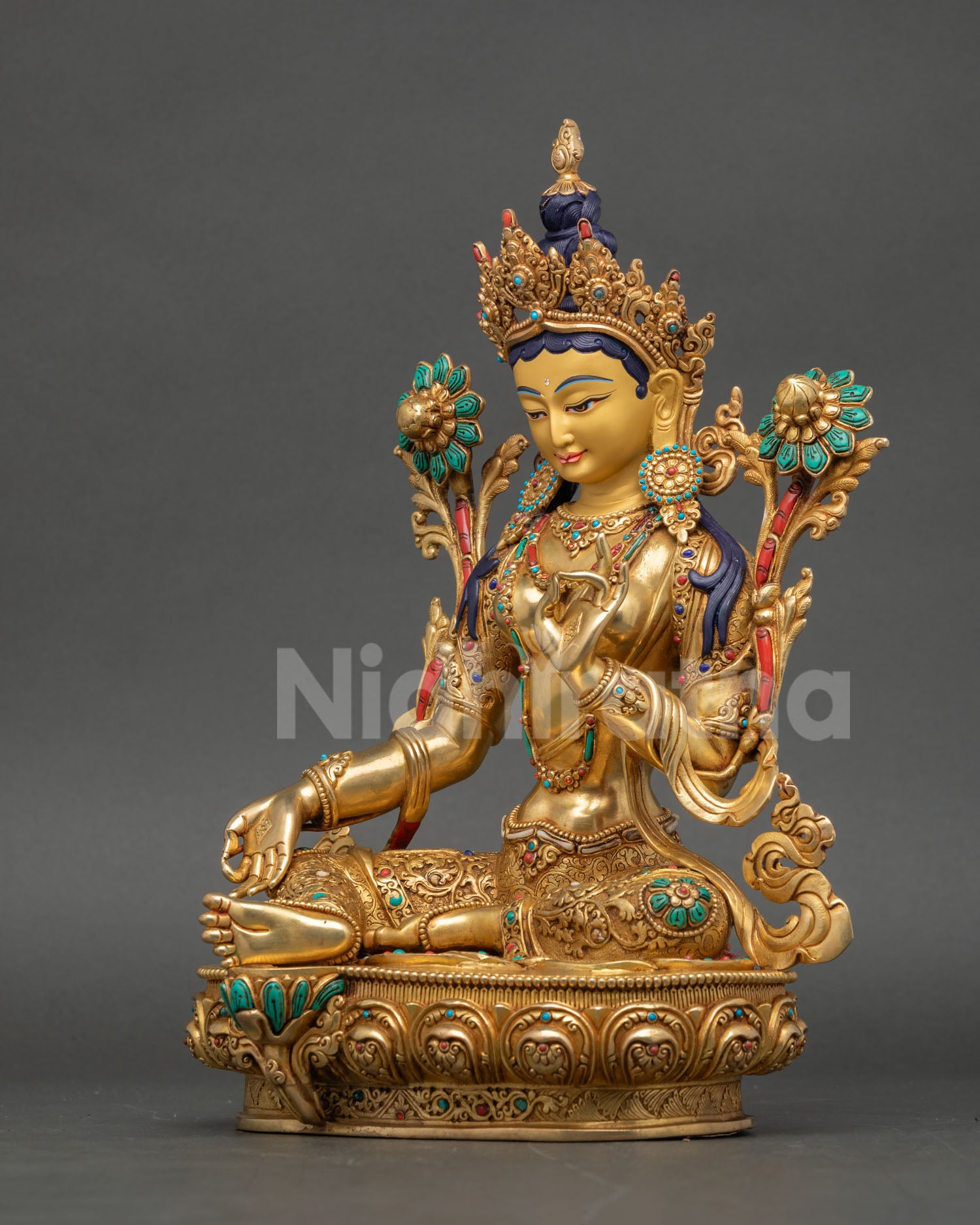 Left view of Green Tara Statue showcasing traditional Buddhist artistry