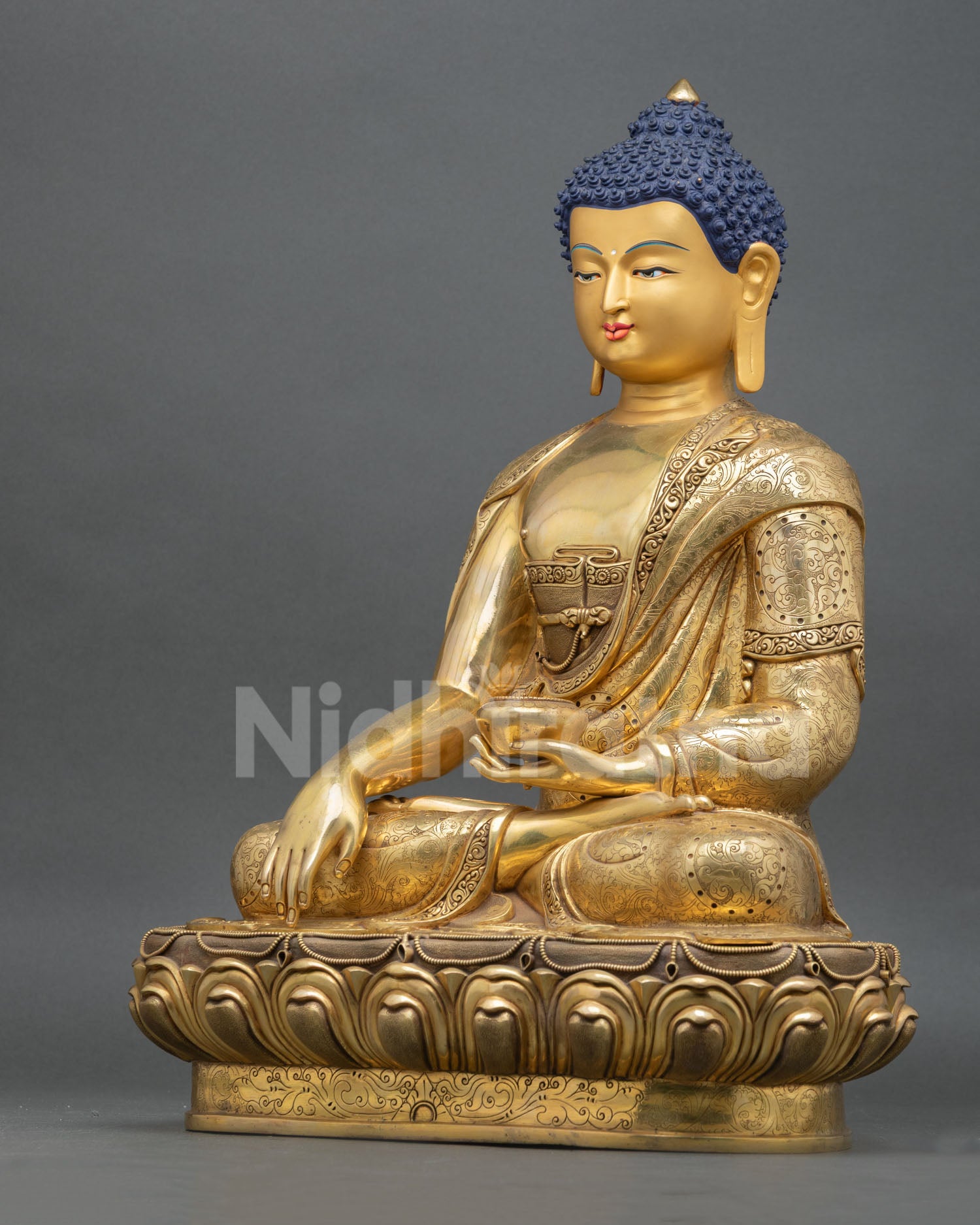 left view of shakyamuni buddha statue handcrafted by newari artisans in patan nepal