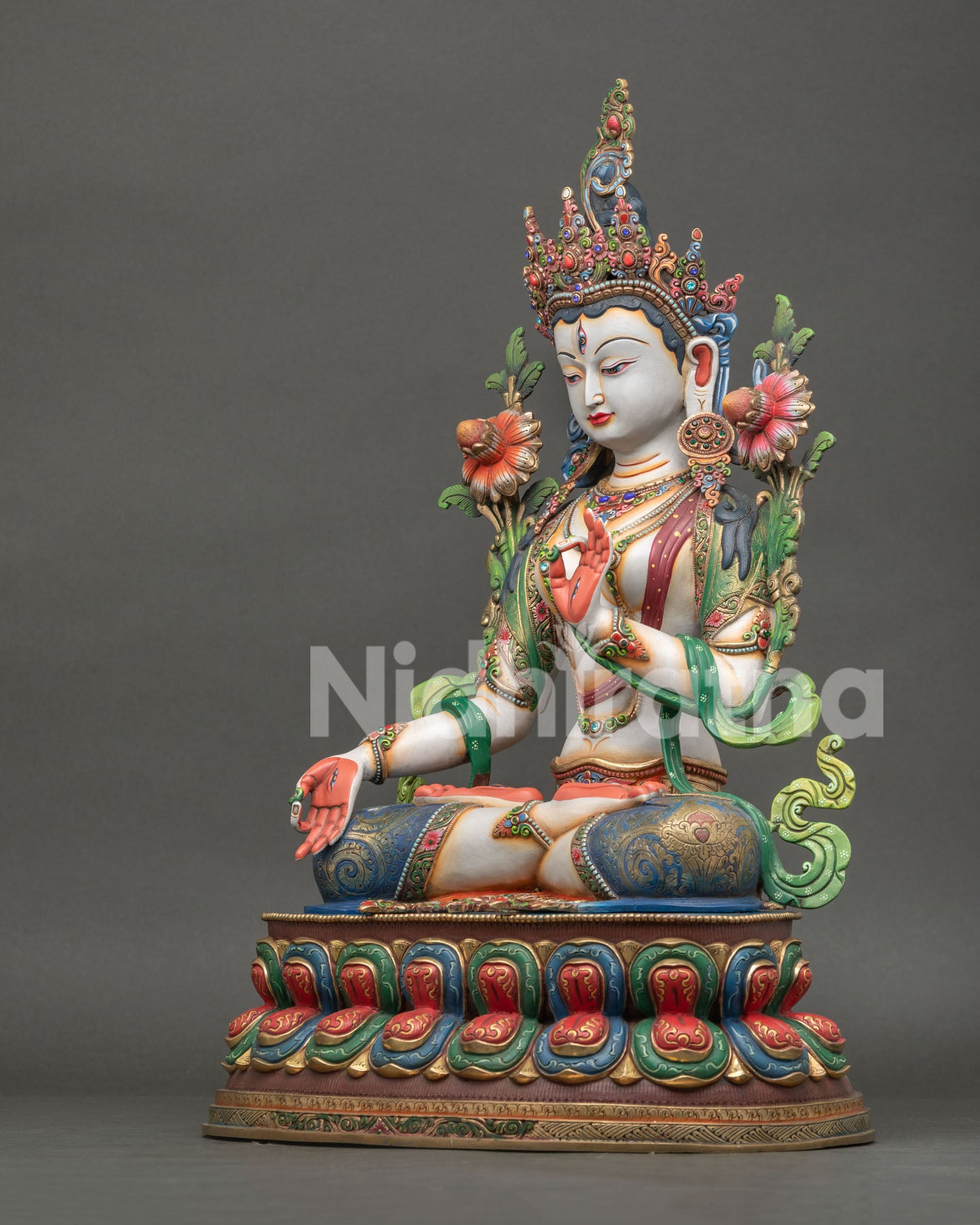 left view of white tara statue with detailed copper craftsmanship and ornate decorations