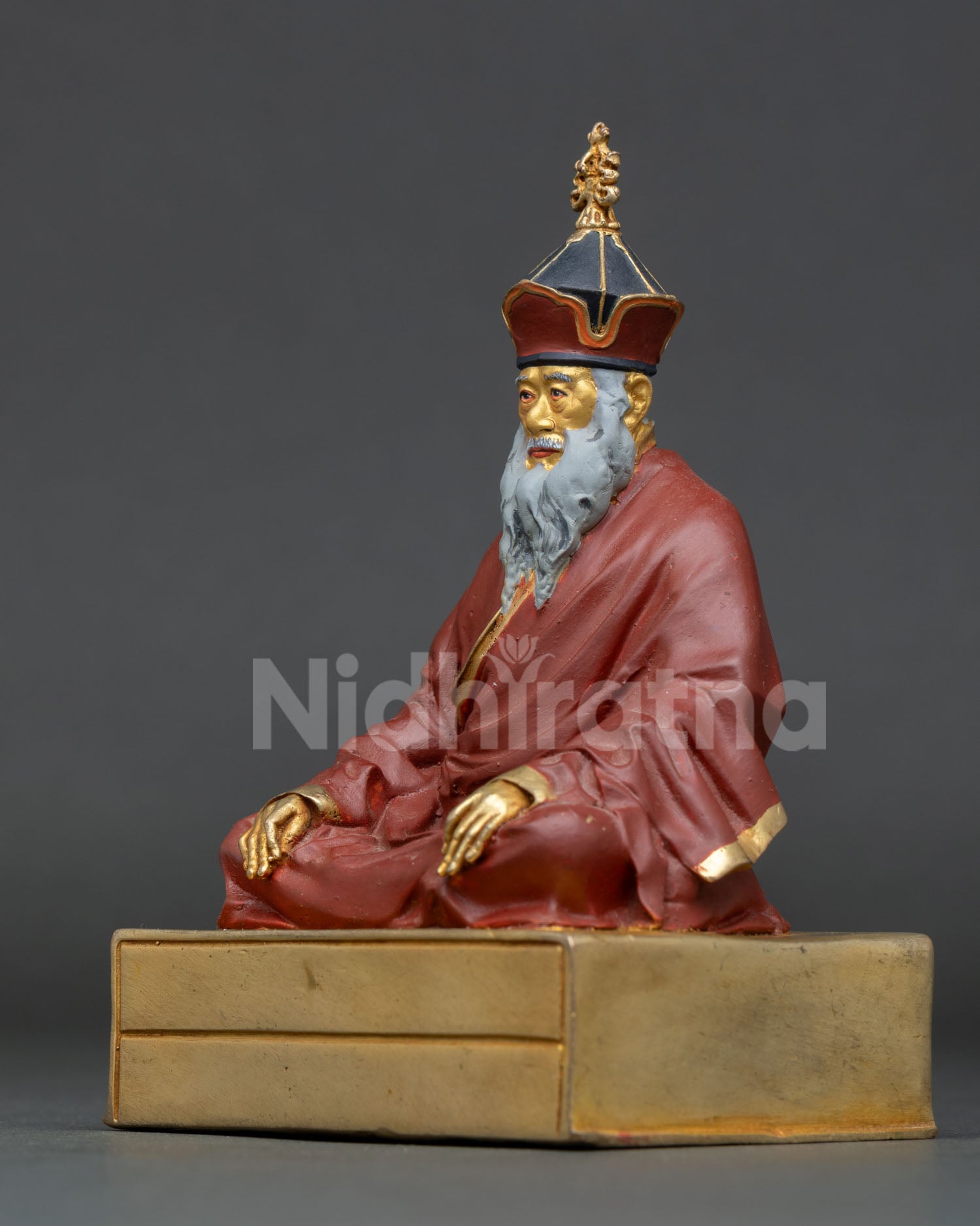 left view side chatral sangye dorje rinpoche left profile meditation statue deep crimson robes fine detailing