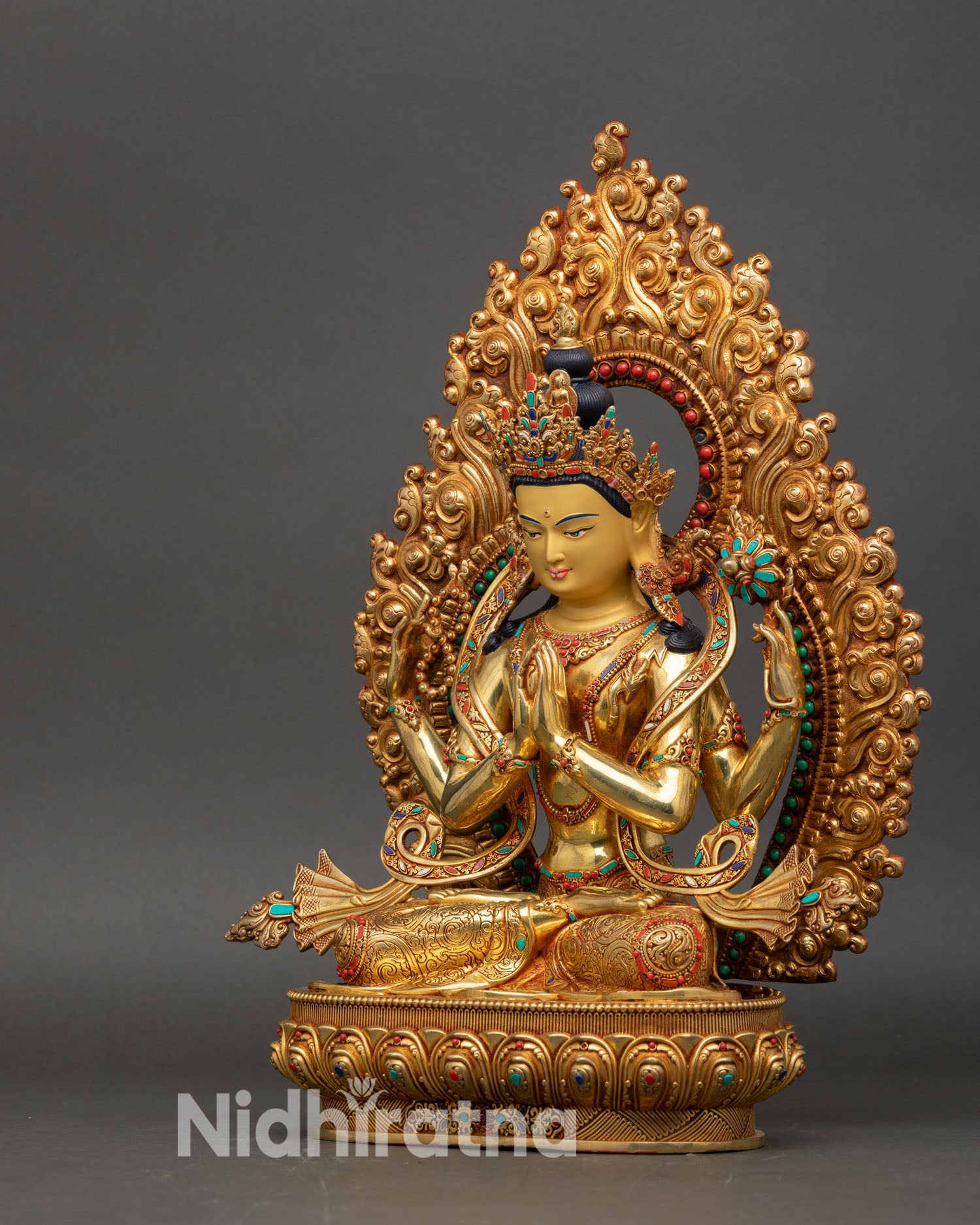 Left view side Chenrezig statue in gold and copper detailed features