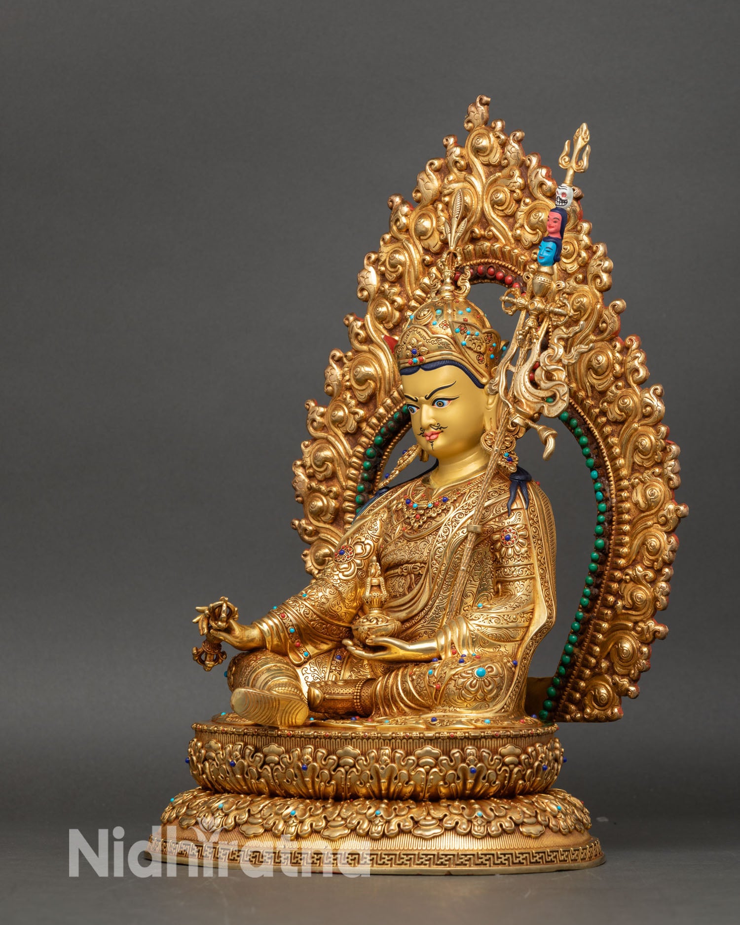 Left side view of Guru Rinpoche statue showcasing handcrafted copper and gold details