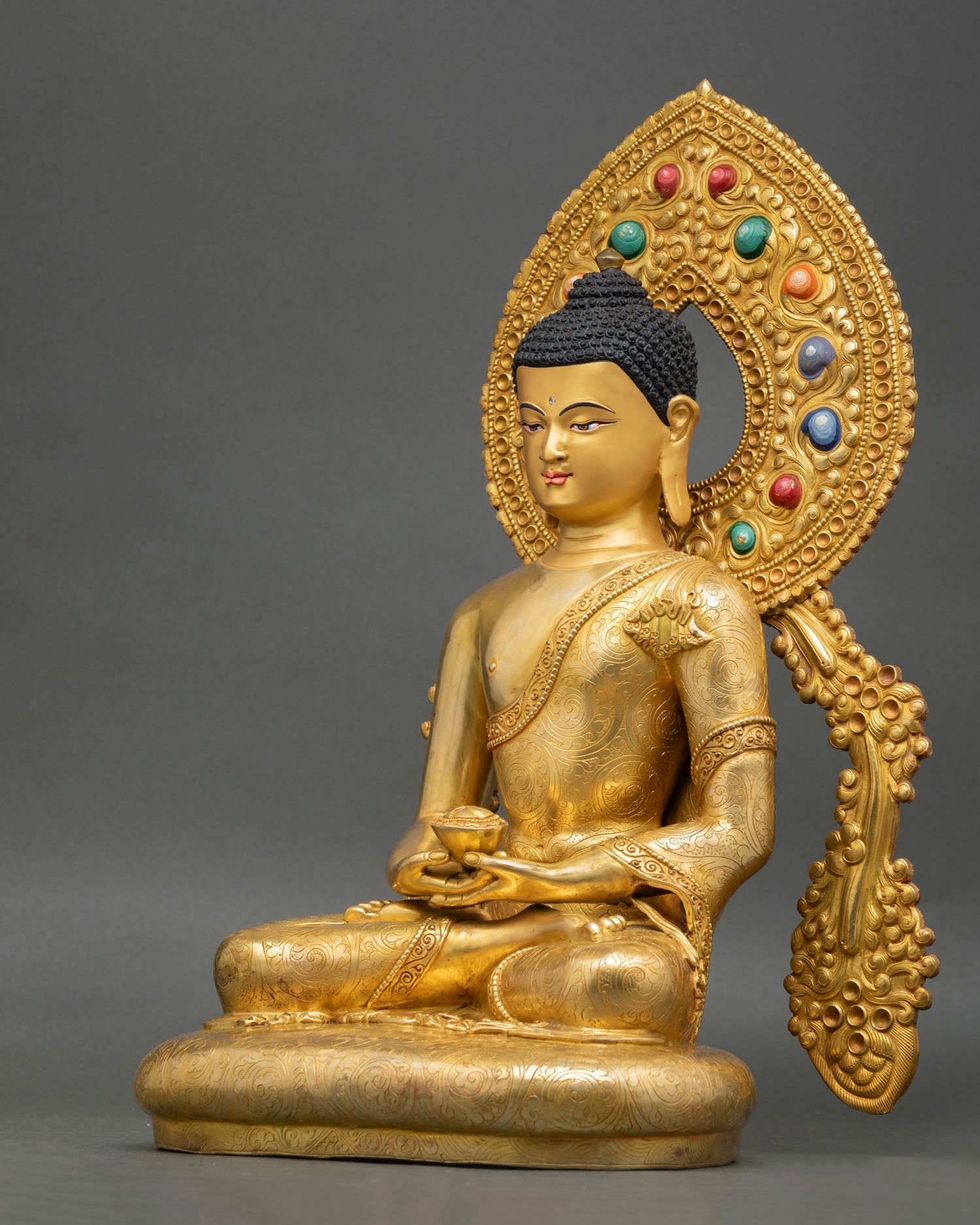left view side of amitabha buddha statue with detailed fire gilded craftsmanship