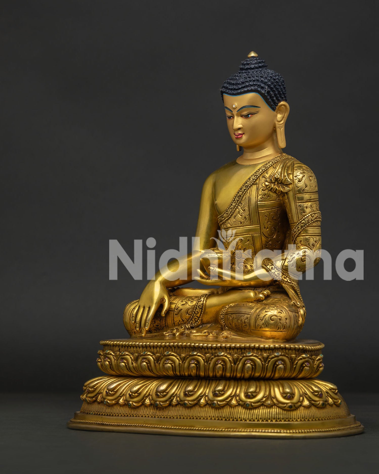 Left view side of Shakyamuni Buddha Statue with copper casting and gold gilded artwork
