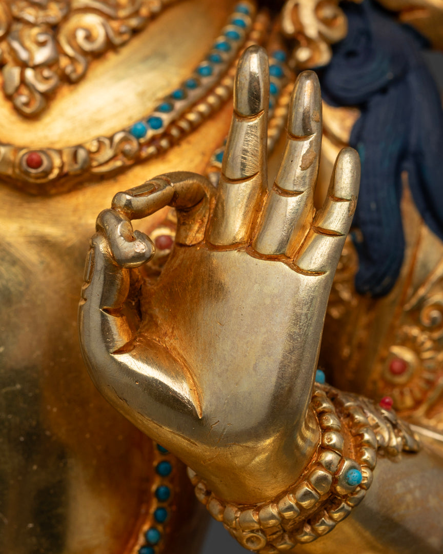 the lefthand of gold plated Manjushree statue