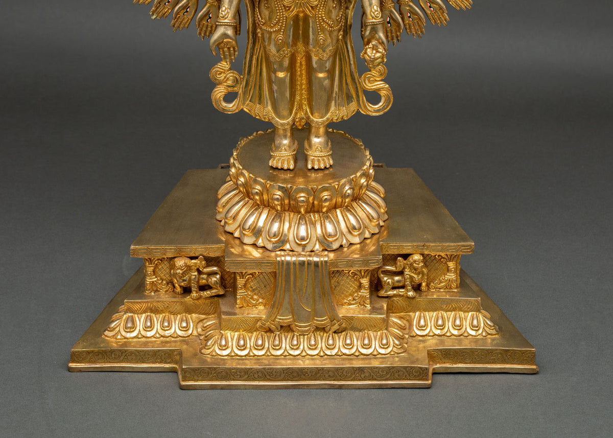 Lotus pedestal and lion throne base of gold fire-gilded Chenrezig statue with carved lions