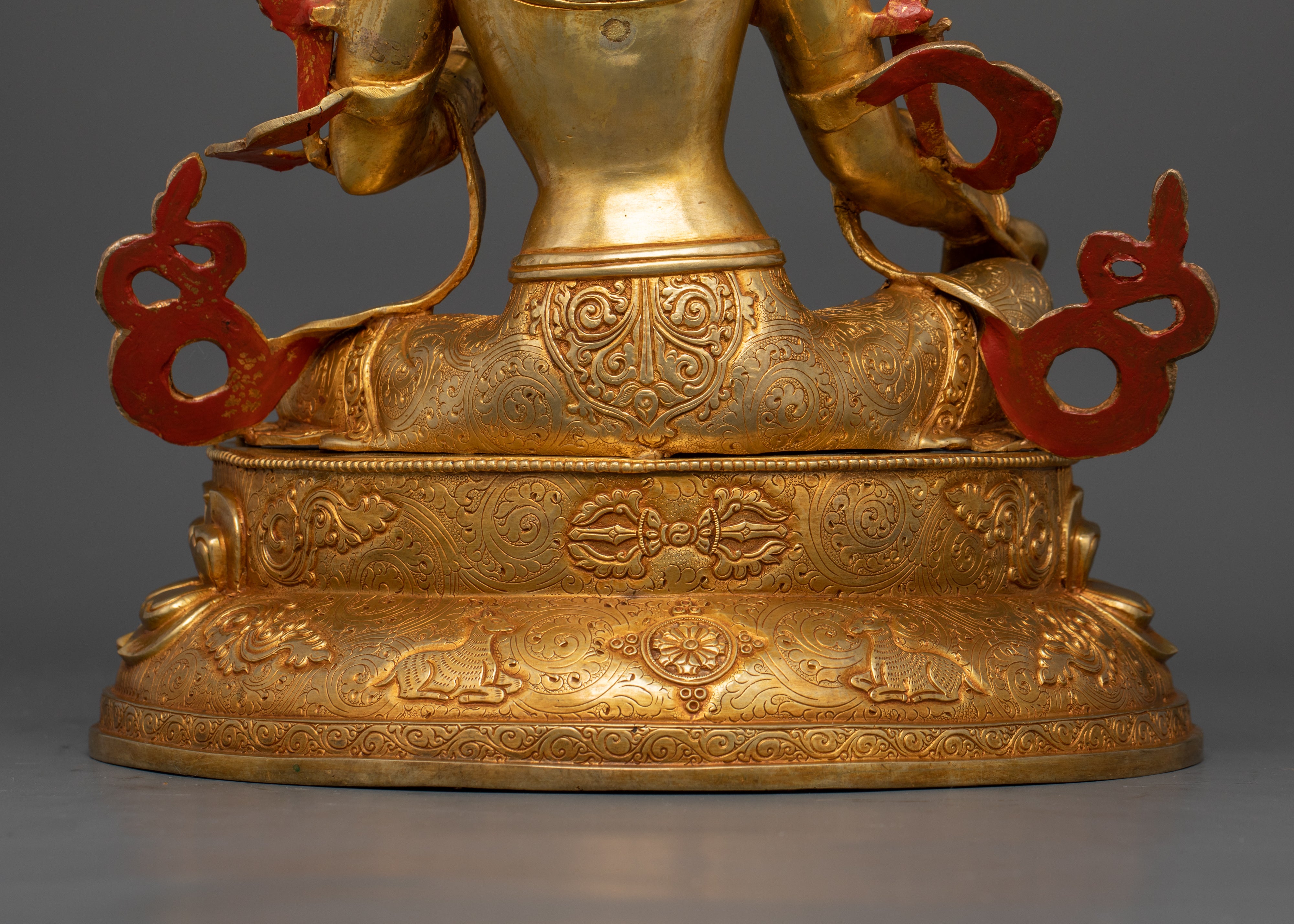 lower back part of green tara statue with width 29 cm