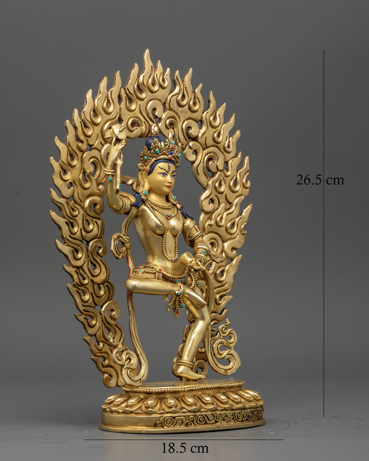 Machig Labdron Buddhist statue with damaru bell and lotus seat.