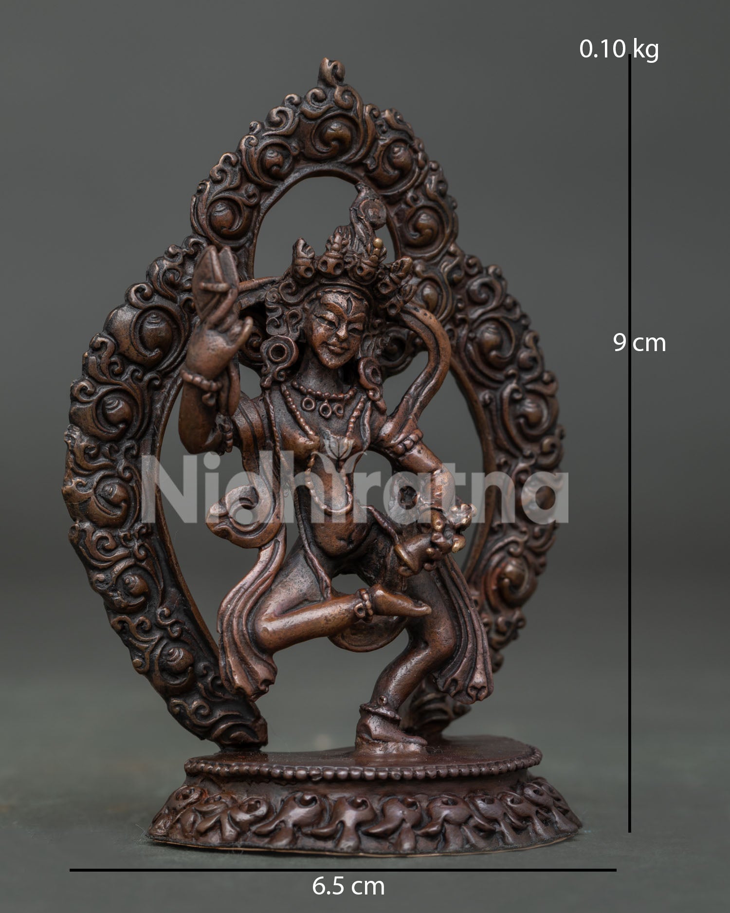 Machig Labdron statue dancing on moon disc above lotus seat with ritual damaru.