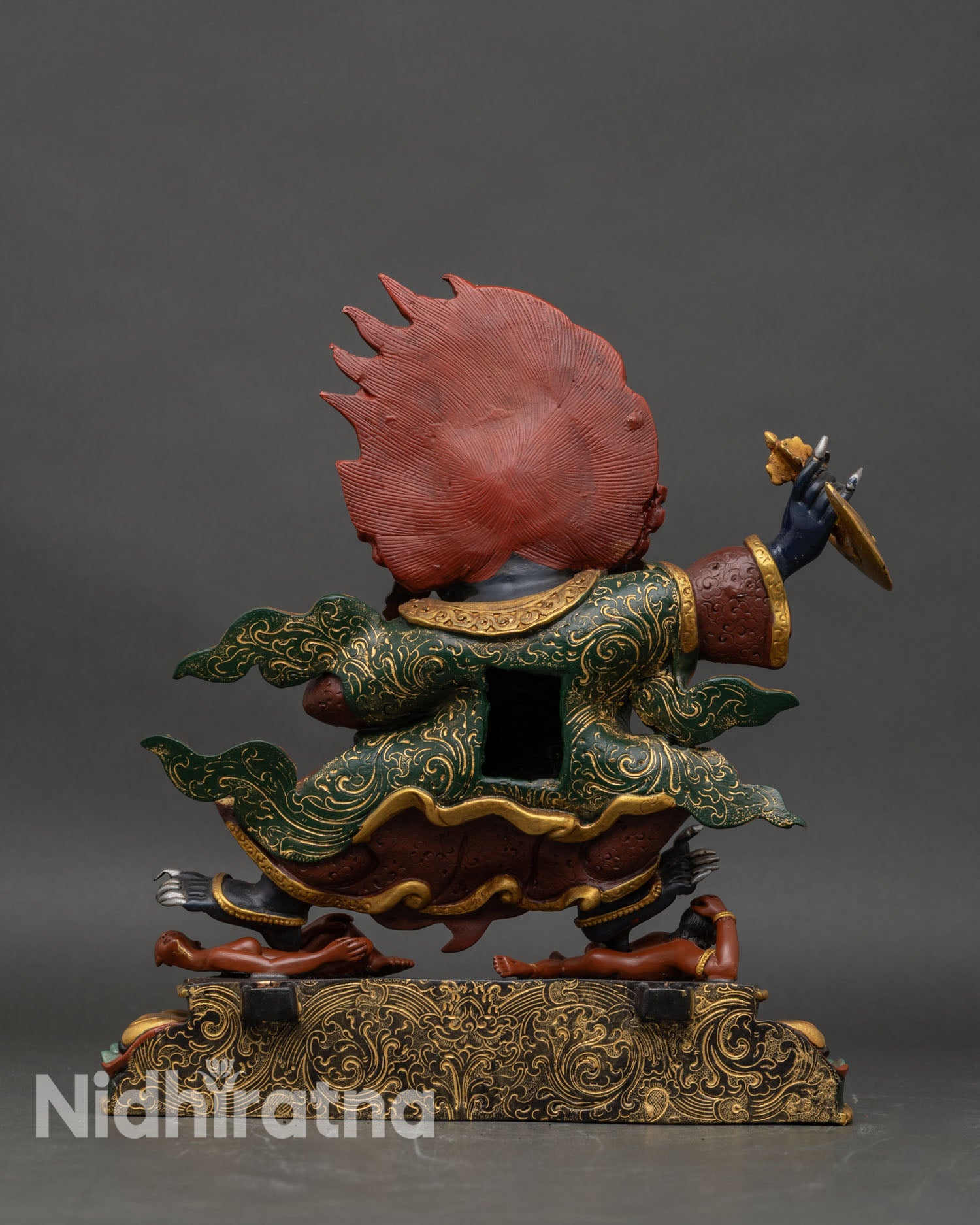Back view of Mahakala Bernagchen statue revealing cloak texture and sculpted detailing