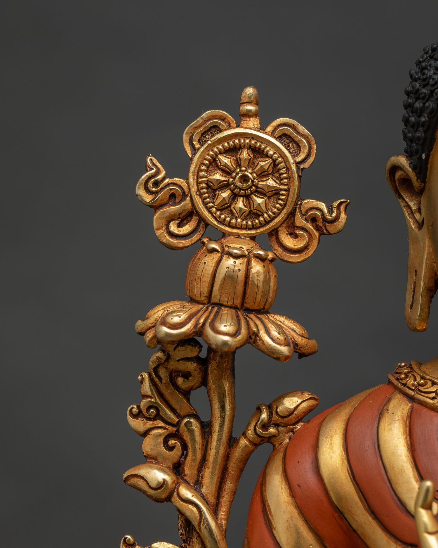 Maitreya Buddha statue left side close-up showing utpala flower and halo details