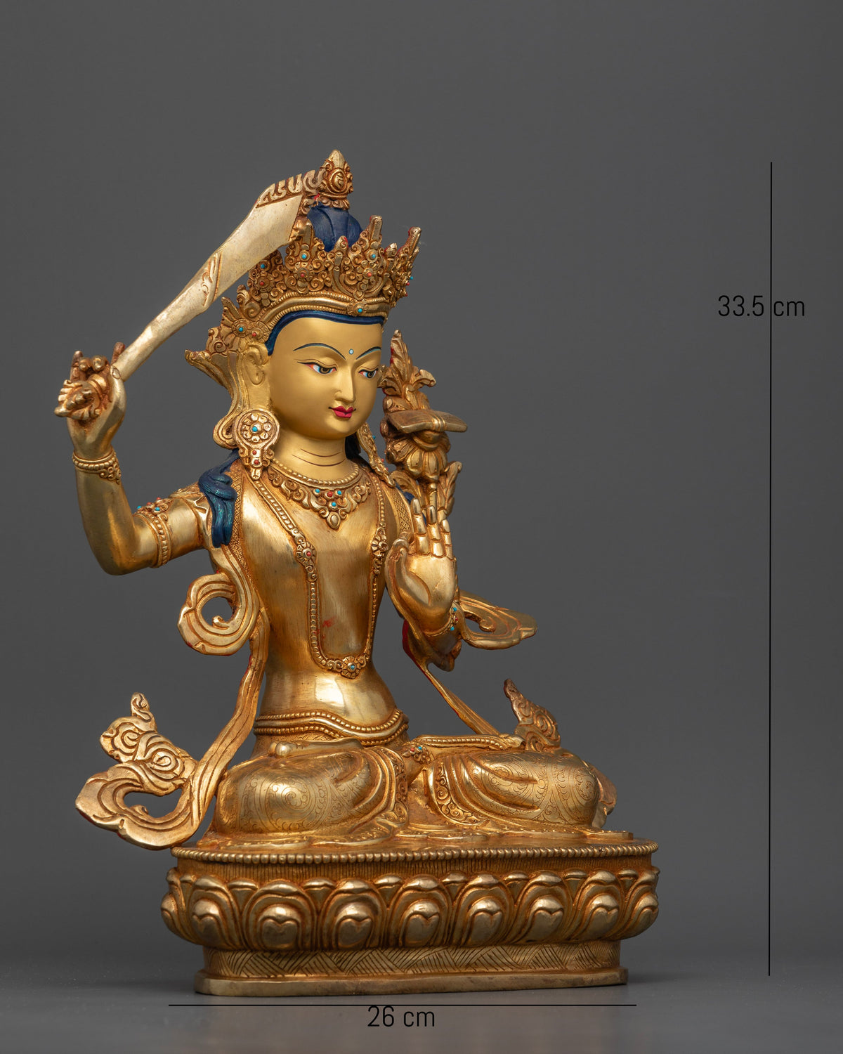 Manjushri Bodhisattva of Wisdom holding flaming double edged sword and utpala stem