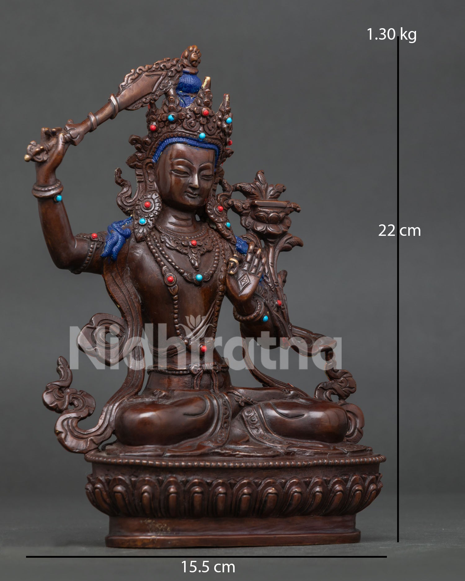 Manjushri Bodhisattva seated on lotus pedestal holding the flaming wisdom sword and Prajnaparamita Sutra