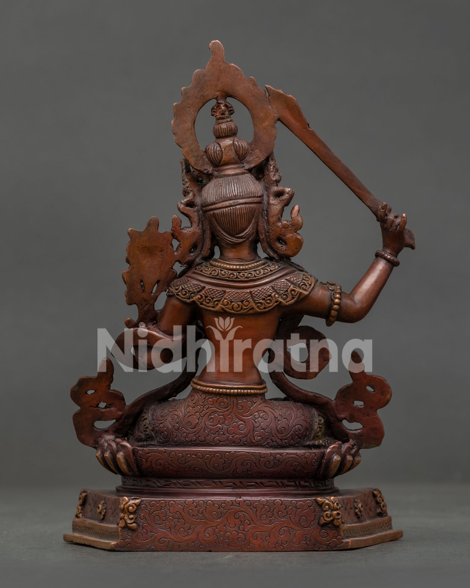 Manjushri Bodhisattva statue seated on lotus pedestal handcrafted Nepalese Buddhist art.