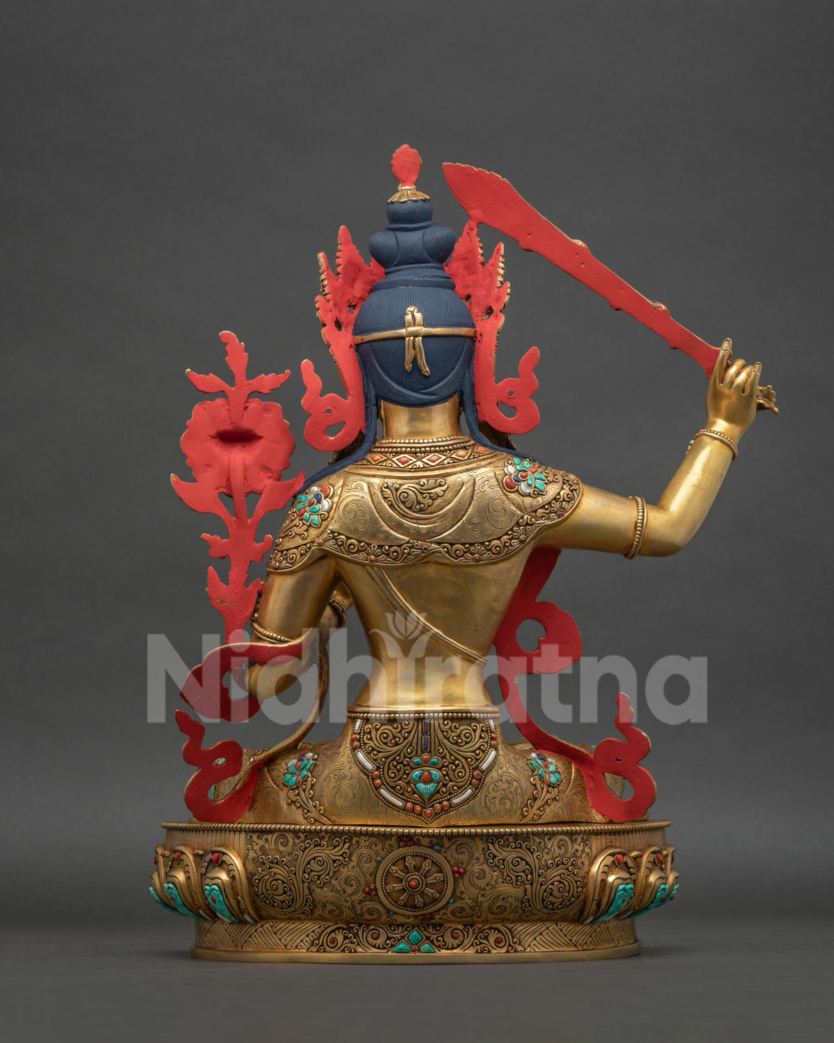 Manjushri Copper Statue back view showing flame nimbus and robe detailing