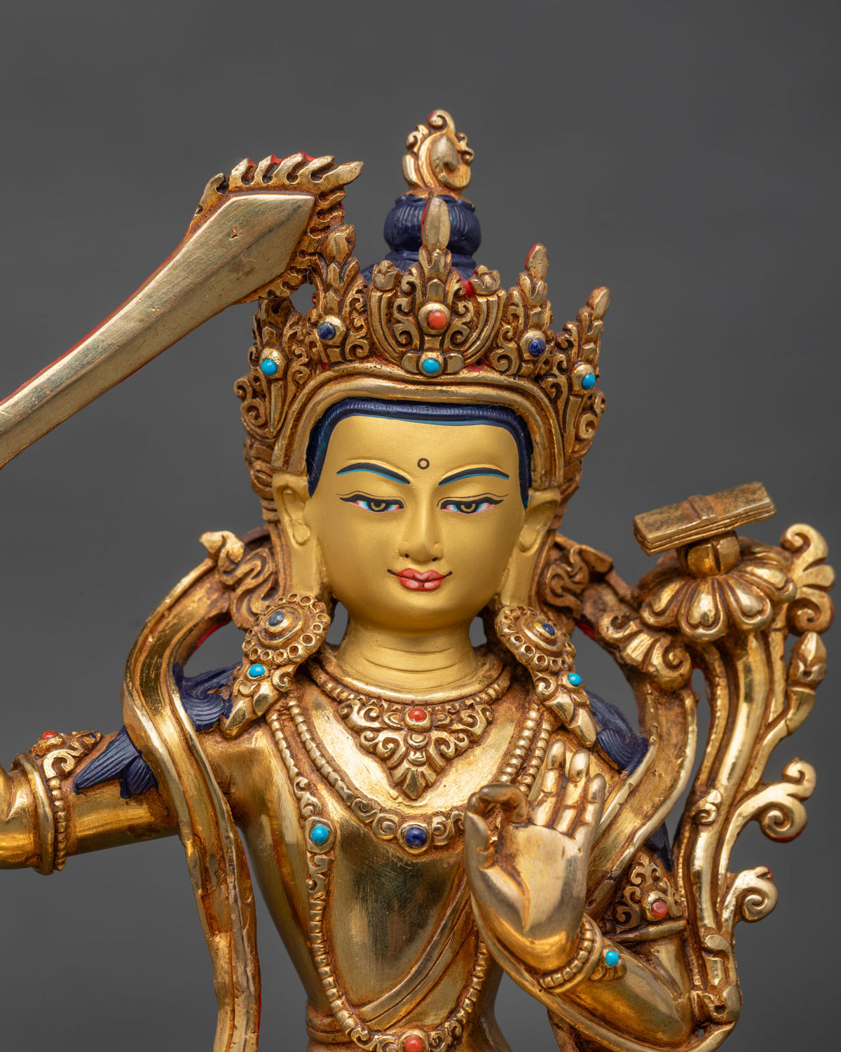 Manjushri statue 24k gold painted face turquoise lapis lazuli coral stones.